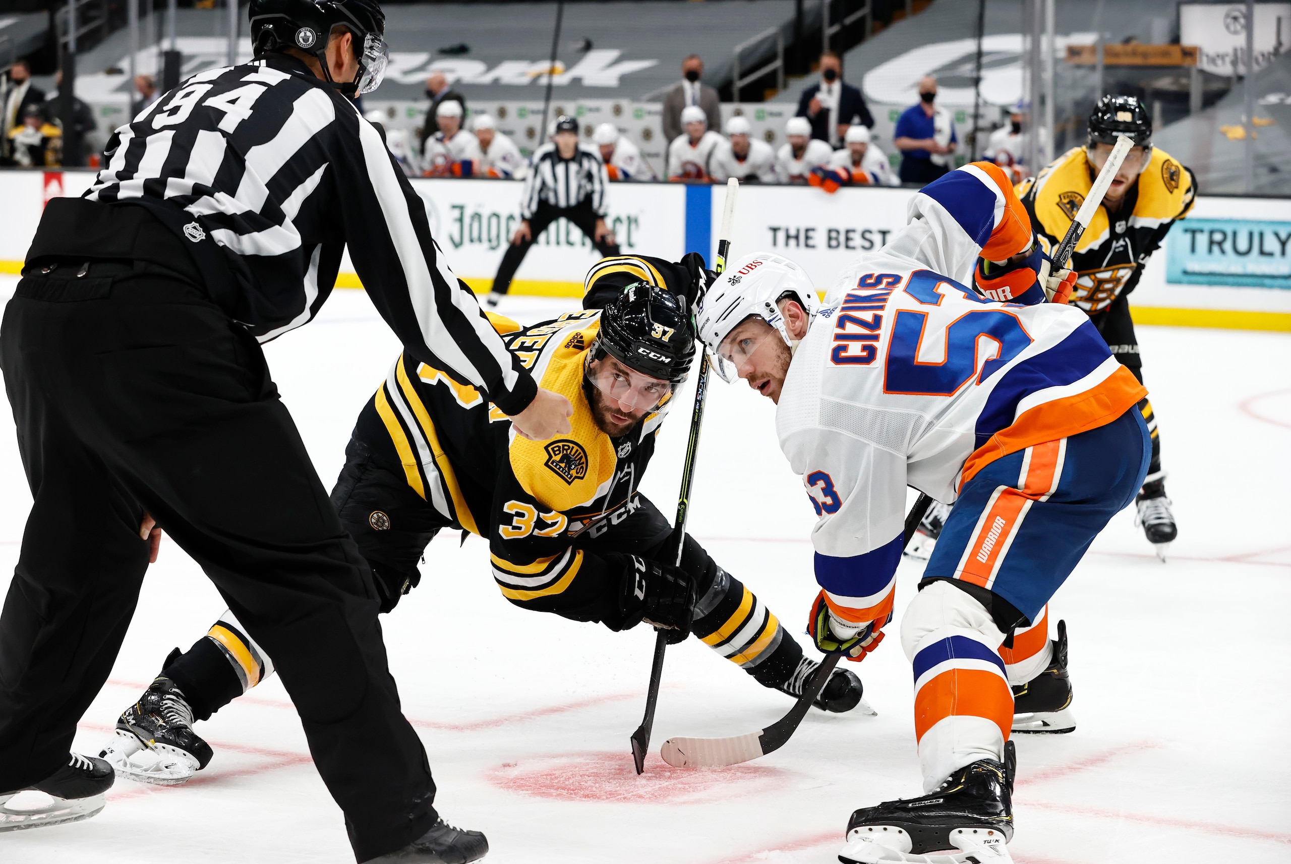 BOSTON, MA - MAY 29: Boston Bruins center Patrice Bergeron (37) and New York Islanders center Casey Cizikas (53) take a fcae off during Game 1 of the NHL Stanley Cup Playoffs Second Round between the Boston Bruins and the NewYork Islanders on May 29, 2021, at TD Garden in Boston, Massachusetts.(Photo by Fred Kfoury III/Icon Sportswire via Getty Images) BOSTON, MA - MAY 29: Boston Bruins center Patrice Bergeron (37) and New York Islanders center Casey Cizikas (53) take a fcae off during Game 1 of the NHL Stanley Cup Playoffs Second Round between the Boston Bruins and the NewYork Islanders on May 29, 2021, at TD Garden in Boston, Massachusetts.(Photo by Fred Kfoury III/Icon Sportswire via Getty Images)