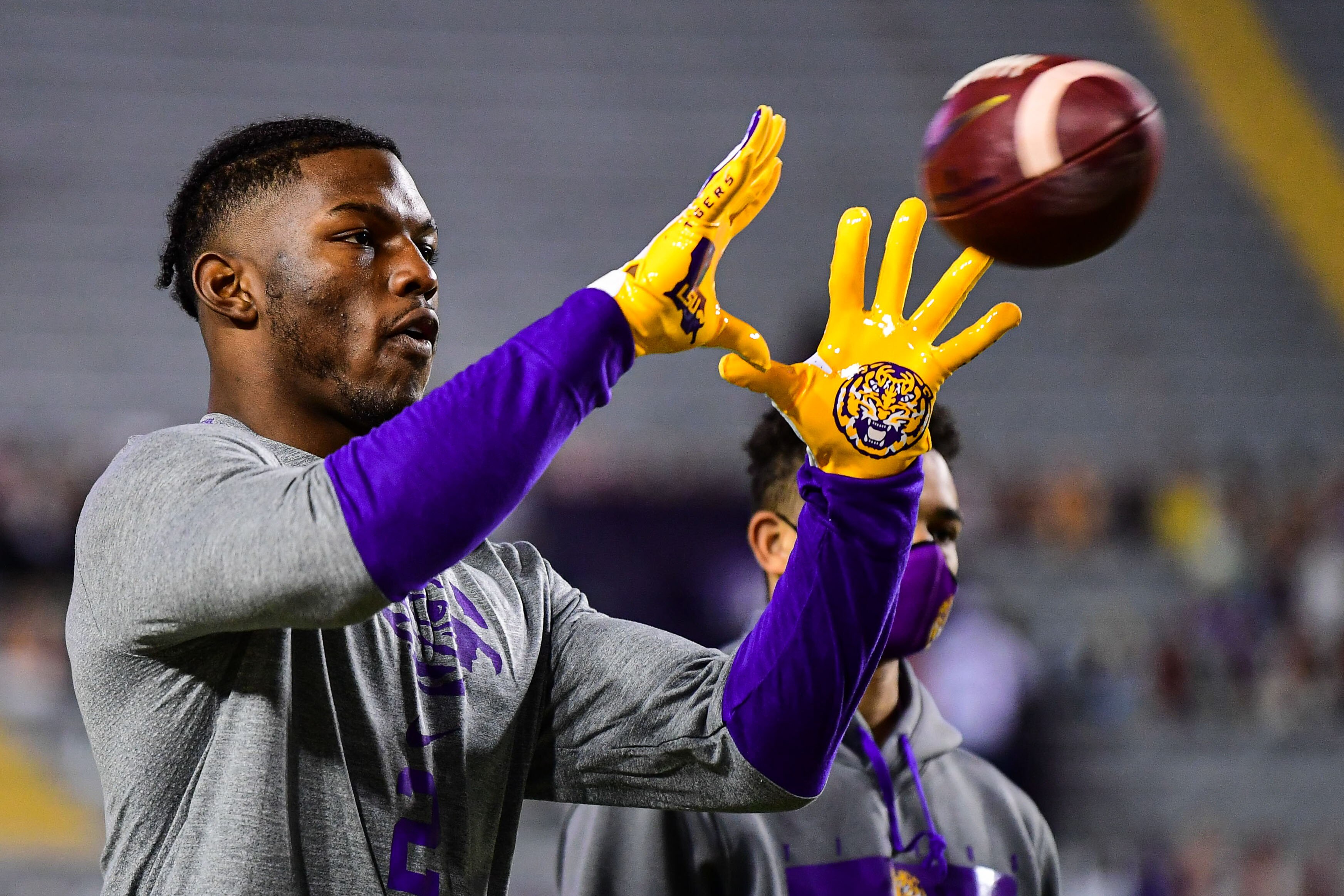 BATON ROUGE, LA - DECEMBER 5: Arik Gilbert #2 of the LSU Tigers warms up before the game against the Alabama Crimson Tide at Tiger Stadium on December 5, 2020 in Baton Rouge, Louisiana. (Photo by Chris Parent/Collegiate Images/Getty Images)