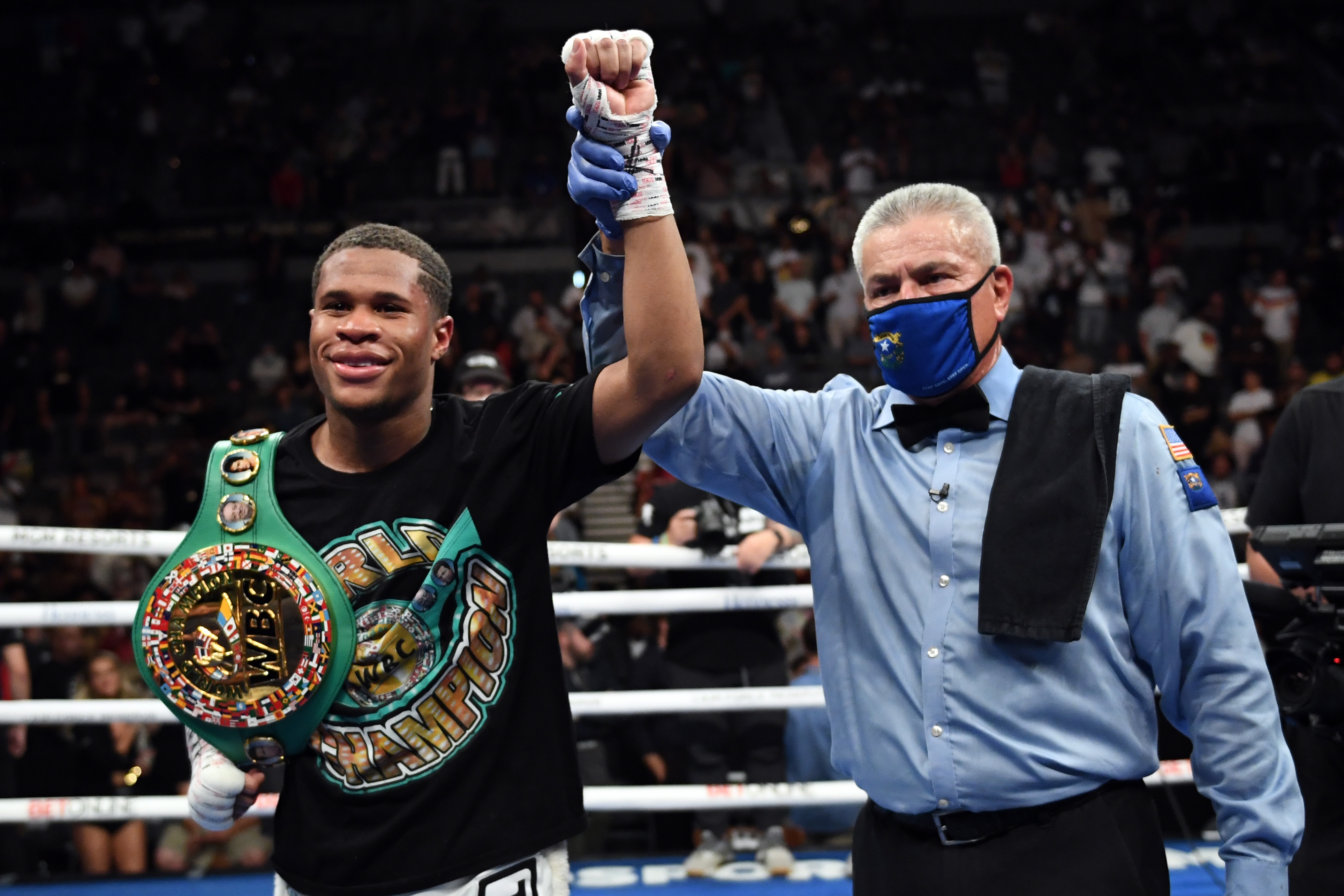 LAS VEGAS, NEVADA - MAY 29:  Devin Haney poses with referee Russell Mora after retaining his title of the WBC lightweight champion against Jorge Linares at Michelob ULTRA Arena on May 29, 2021 in Las Vegas, Nevada. (Photo by David Becker/Getty Images)