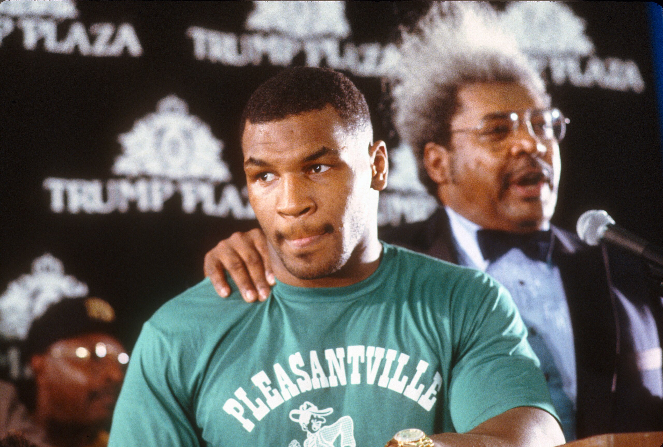 ATLANTIC CITY, NJ - CIRCA 1988:  Mike Tyson with promoter Don King prior to fighting Michael Spinks for the WBC, WBA and Ring Heavyweight titles on circa 1988 at the Convention Hall in Atlantic City, New Jersey. Tyson won the fight with a first round knock out. (Photo by Focus on Sport/Getty Images)