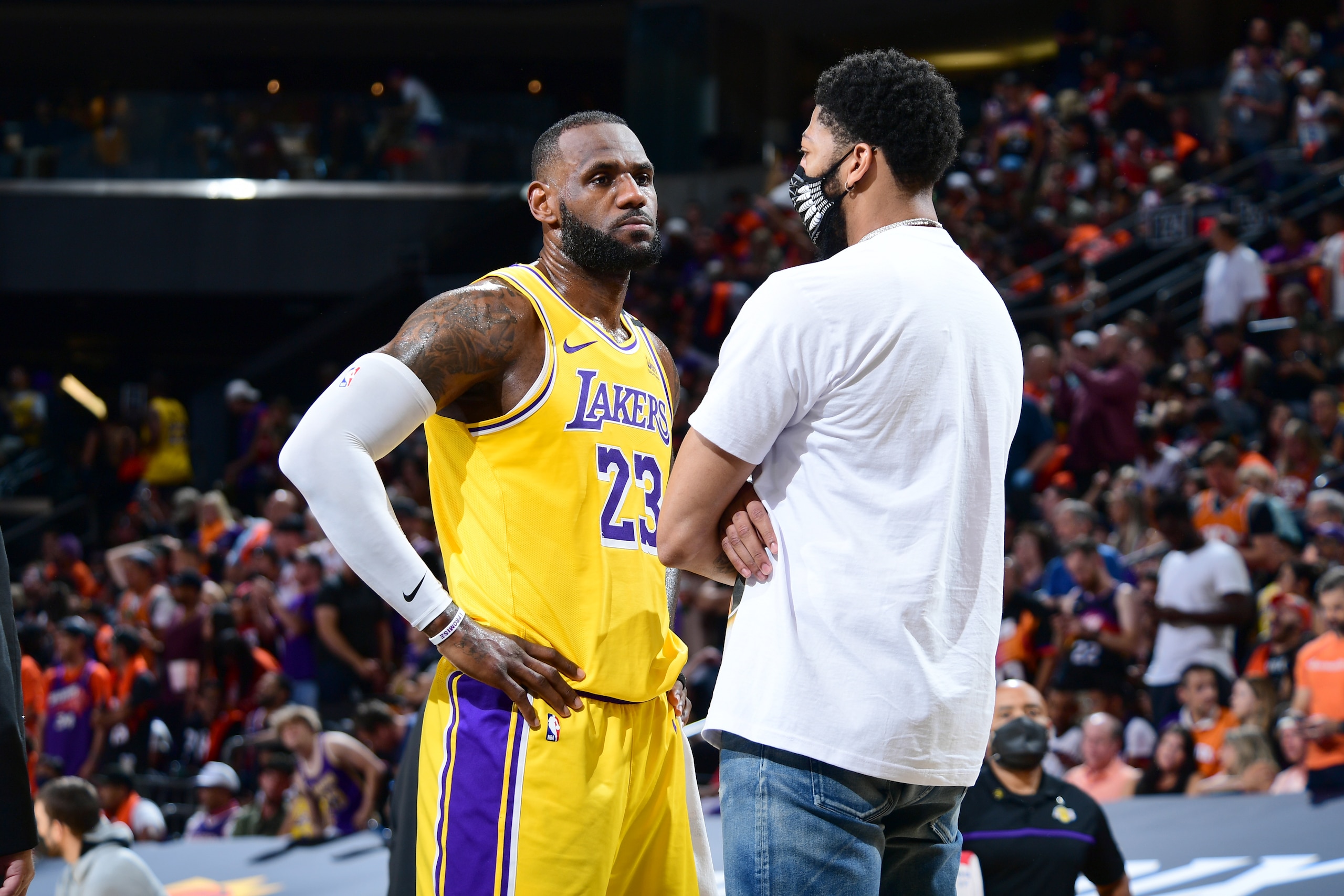PHOENIX, AZ - JUNE 1:  LeBron James #23 and Anthony Davis #3 of the Los Angeles Lakers talk during Round 1, Game 5 of the 2021 NBA Playoffs on June 1, 2021 at Phoenix Suns Arena in Phoenix, Arizona. NOTE TO USER: User expressly acknowledges and agrees that, by downloading and or using this photograph, user is consenting to the terms and conditions of the Getty Images License Agreement. Mandatory Copyright Notice: Copyright 2021 NBAE (Photo by Michael Gonzales/NBAE via Getty Images)