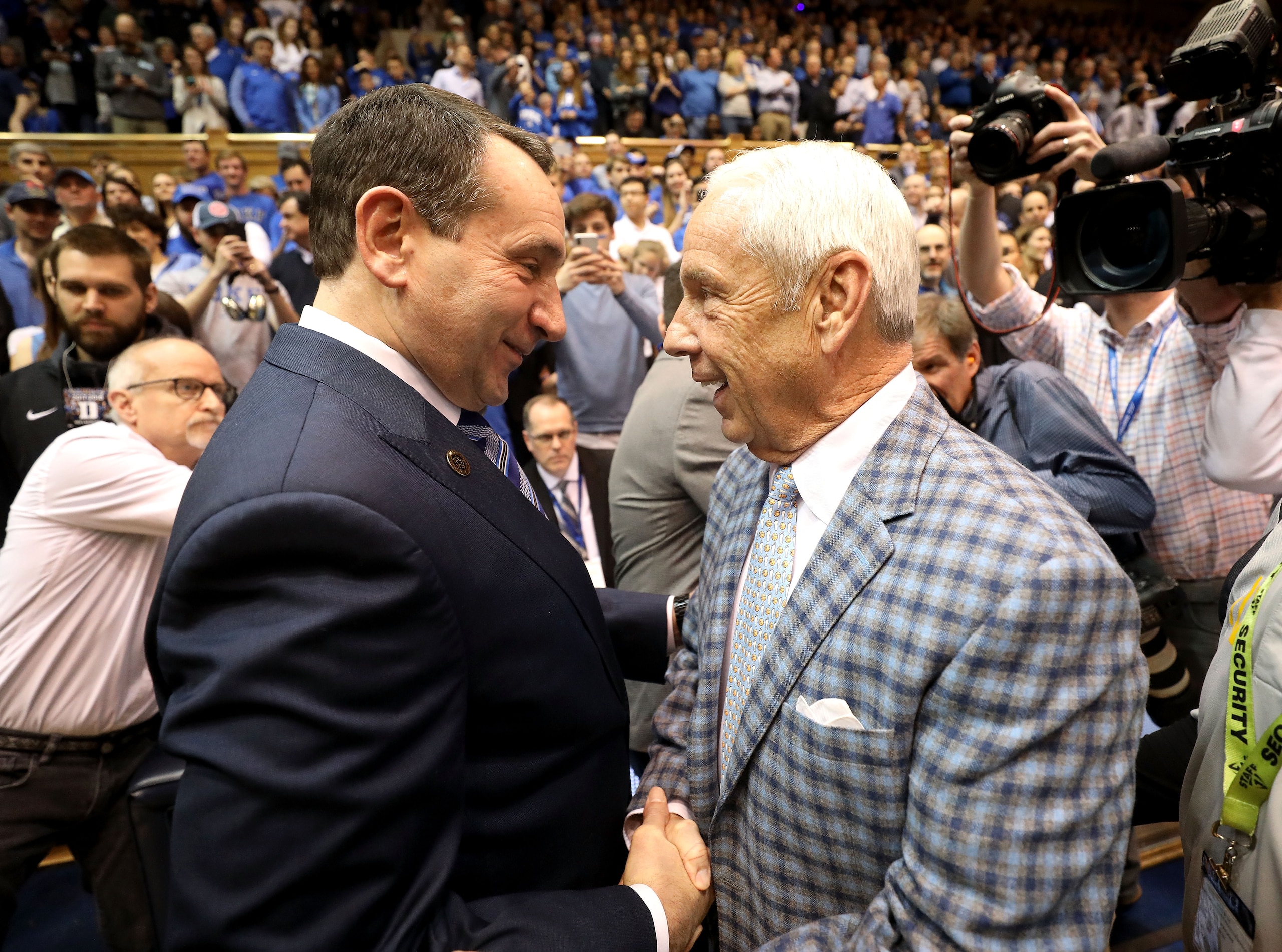 DURHAM, NC - MARCH 03:  (L-R) Head coach Mike Krzyzewski of the Duke Blue Devils talks to head coach Roy Williams of the North Carolina Tar Heels before their game at Cameron Indoor Stadium on March 3, 2018 in Durham, North Carolina.  (Photo by Streeter Lecka/Getty Images)