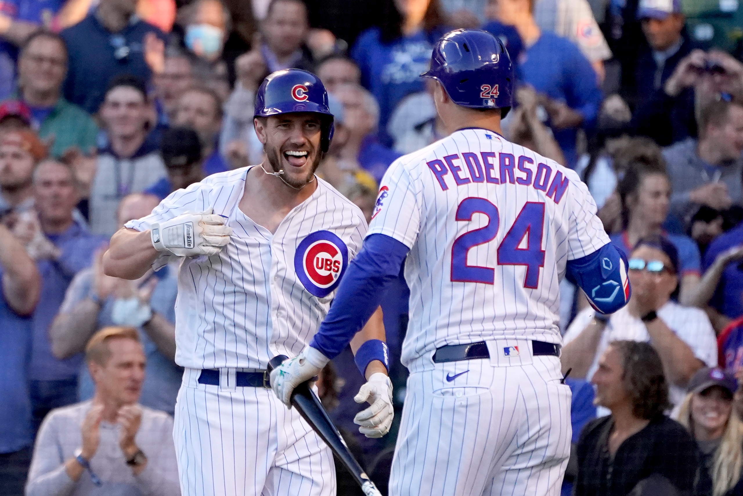 Chicago Cubs' Patrick Wisdom, left, celebrates his two-run home run off San Diego Padres starting pitcher Ryan Weathers with Joc Pederson during the second inning of a baseball game Tuesday, June 1, 2021, in Chicago. (AP Photo/Charles Rex Arbogast)