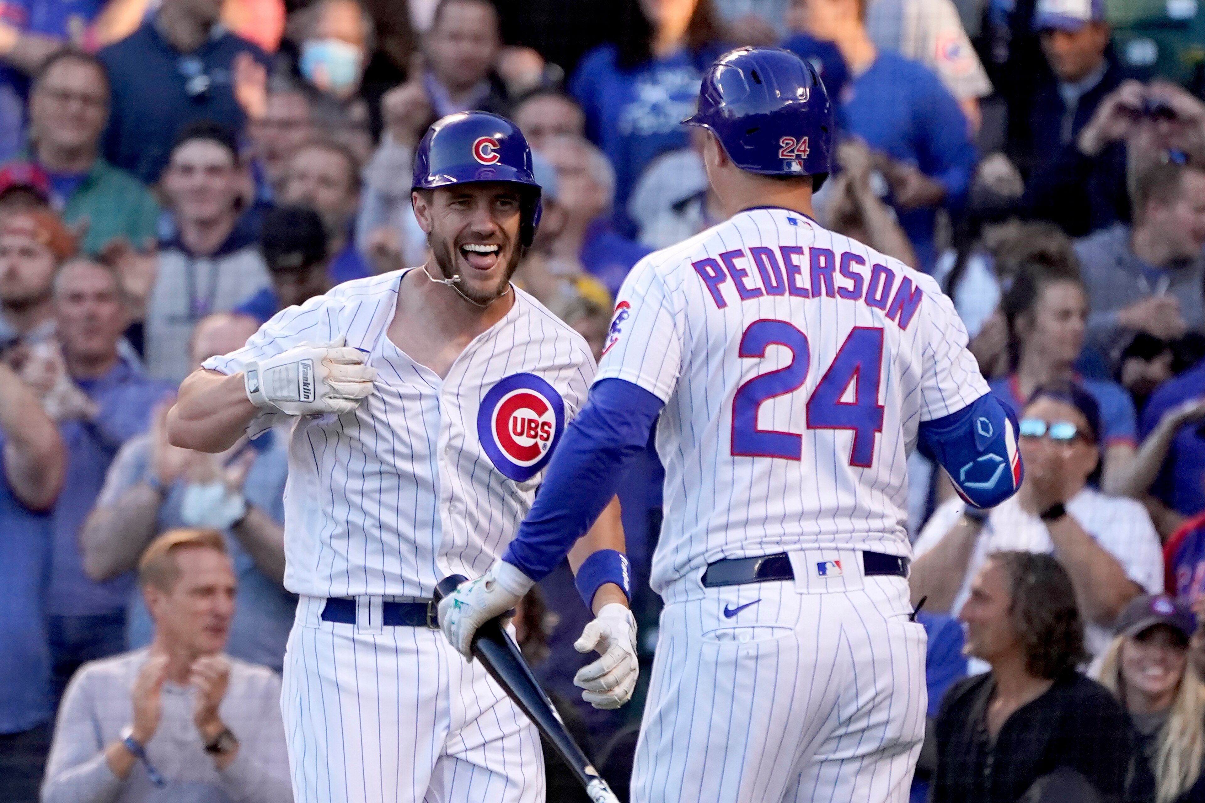 Chicago Cubs' Patrick Wisdom, left, celebrates his two-run home run off San Diego Padres starting pitcher Ryan Weathers with Joc Pederson during the second inning of a baseball game Tuesday, June 1, 2021, in Chicago. (AP Photo/Charles Rex Arbogast)