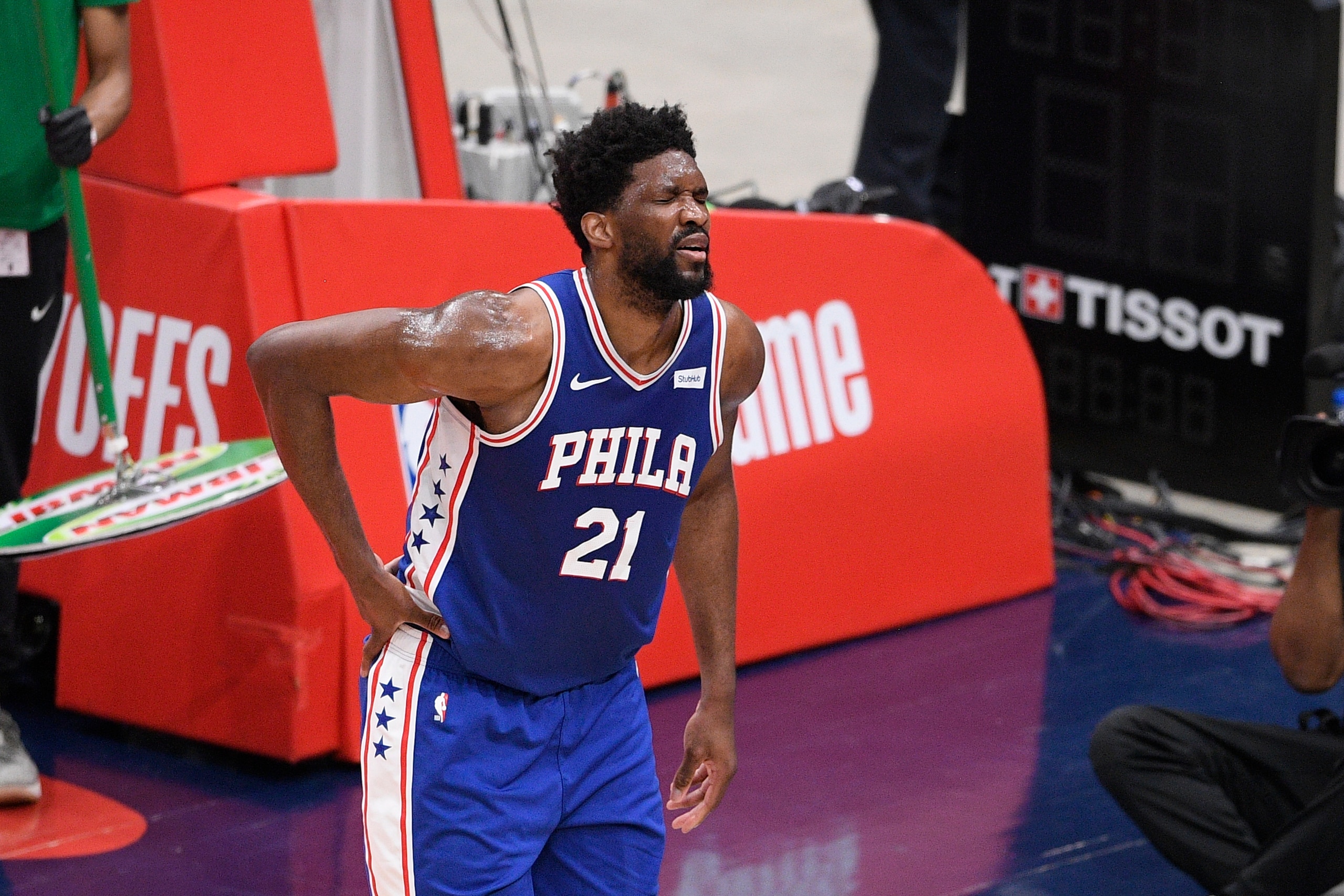 Philadelphia 76ers center Joel Embiid (21) reacts after he fell on the court during the first half of Game 4 in a first-round NBA basketball playoff series against the Washington Wizards, Monday, May 31, 2021, in Washington. (AP Photo/Nick Wass)