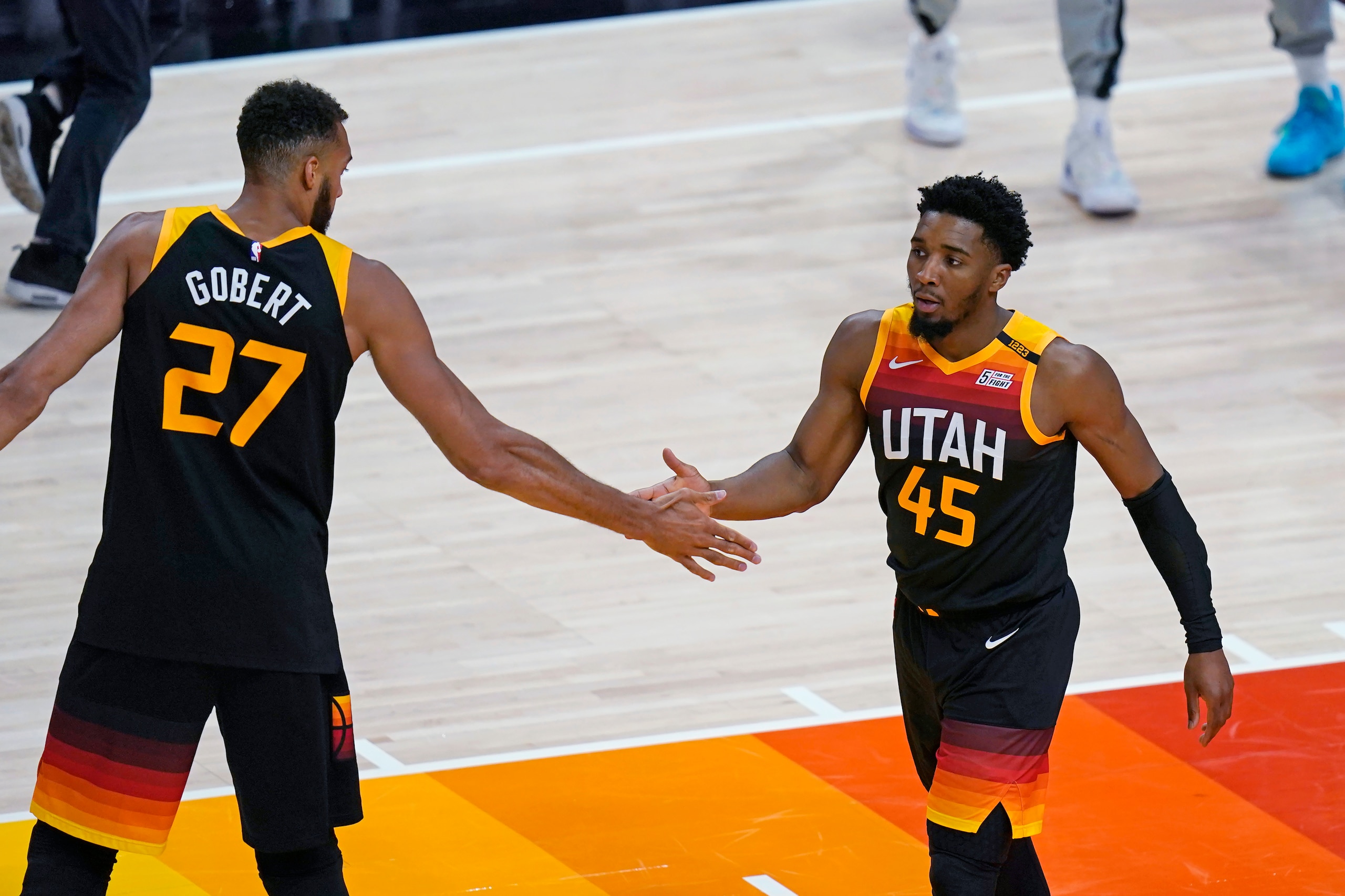 Utah Jazz's Rudy Gobert (27) congratulates Donovan Mitchell (45) after he scored against the Memphis Grizzlies during the first half of Game 5 of an NBA basketball first-round playoff series Wednesday, June 2, 2021, in Salt Lake City. (AP Photo/Rick Bowmer) Utah Jazz's Rudy Gobert (27) congratulates Donovan Mitchell (45) after he scored against the Memphis Grizzlies during the first half of Game 5 of an NBA basketball first-round playoff series Wednesday, June 2, 2021, in Salt Lake City. (AP Photo/Rick Bowmer)