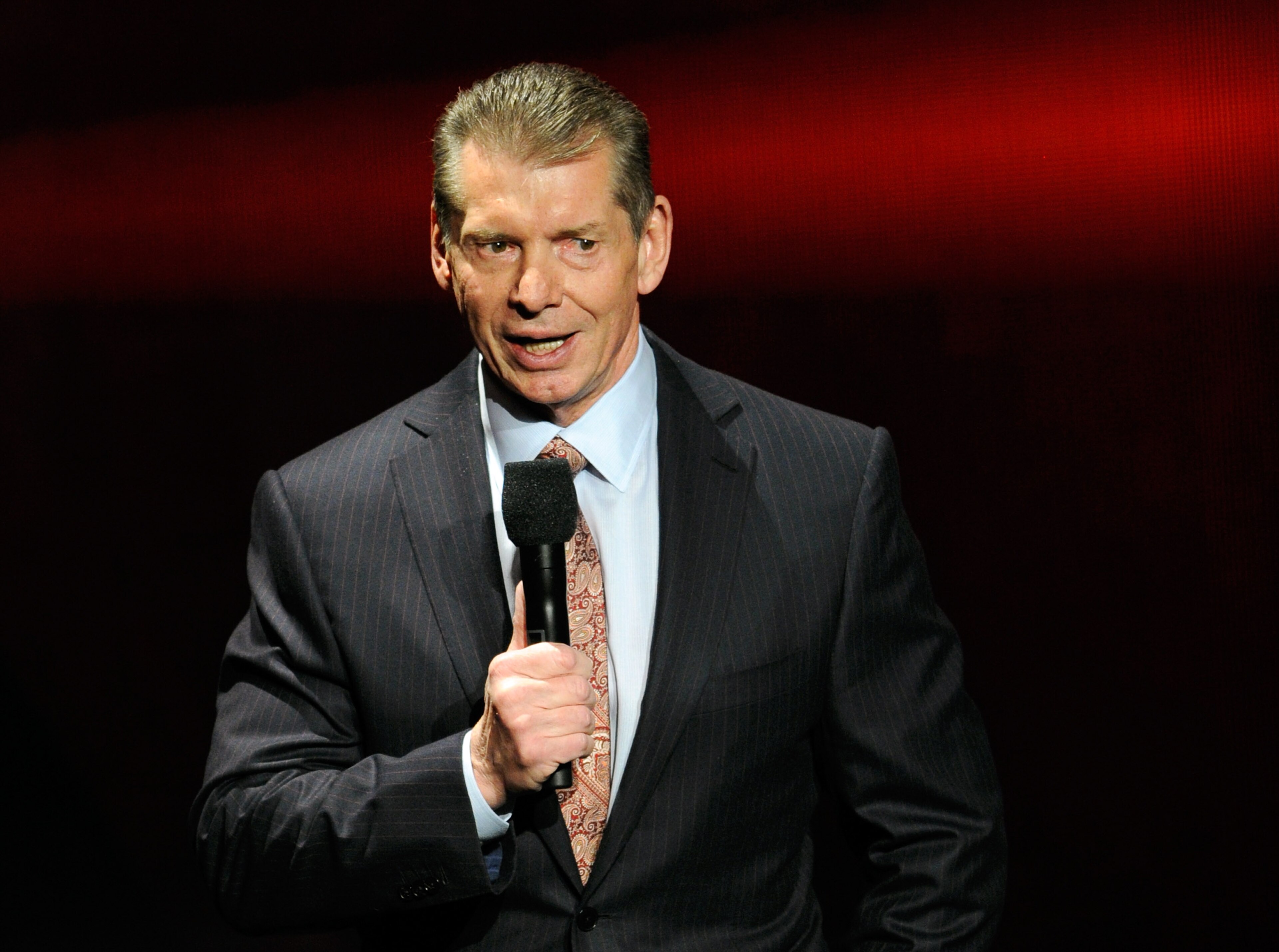 LAS VEGAS, NV - JANUARY 08: WWE Chairman and CEO Vince McMahon speaks at a news conference announcing the WWE Network at the 2014 International CES at the Encore Theater at Wynn Las Vegas on January 8, 2014 in Las Vegas, Nevada. The network will launch on February 24, 2014 as the first-ever 24/7 streaming network, offering both scheduled programs and video on demand. The USD 9.99 per month subscription will include access to all 12 live WWE pay-per-view events each year. CES, the world's largest annual consumer technology trade show, runs through January 10 and is expected to feature 3,200 exhibitors showing off their latest products and services to about 150,000 attendees. (Photo by Ethan Miller/Getty Images) LAS VEGAS, NV - JANUARY 08: WWE Chairman and CEO Vince McMahon speaks at a news conference announcing the WWE Network at the 2014 International CES at the Encore Theater at Wynn Las Vegas on January 8, 2014 in Las Vegas, Nevada. The network will launch on February 24, 2014 as the first-ever 24/7 streaming network, offering both scheduled programs and video on demand. The USD 9.99 per month subscription will include access to all 12 live WWE pay-per-view events each year. CES, the world's largest annual consumer technology trade show, runs through January 10 and is expected to feature 3,200 exhibitors showing off their latest products and services to about 150,000 attendees. (Photo by Ethan Miller/Getty Images)