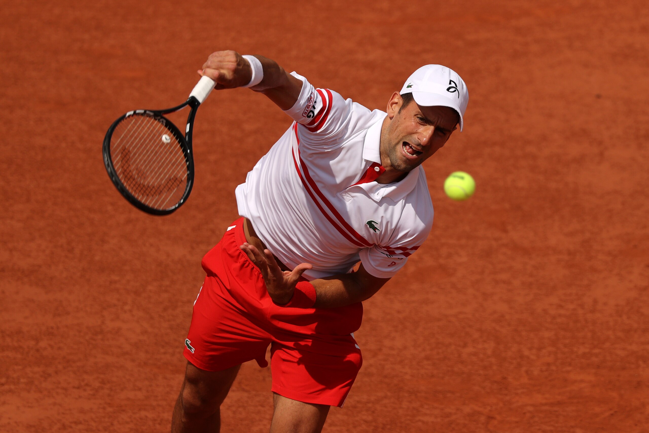 PARIS, FRANCE - JUNE 03:  Novak Djokovic of Serbia serves during his mens second round match against Pablo Cuevas of Uruguay during day five of the 2021 French Open at Roland Garros on June 03, 2021 in Paris, France. (Photo by Clive Brunskill/Getty Images)