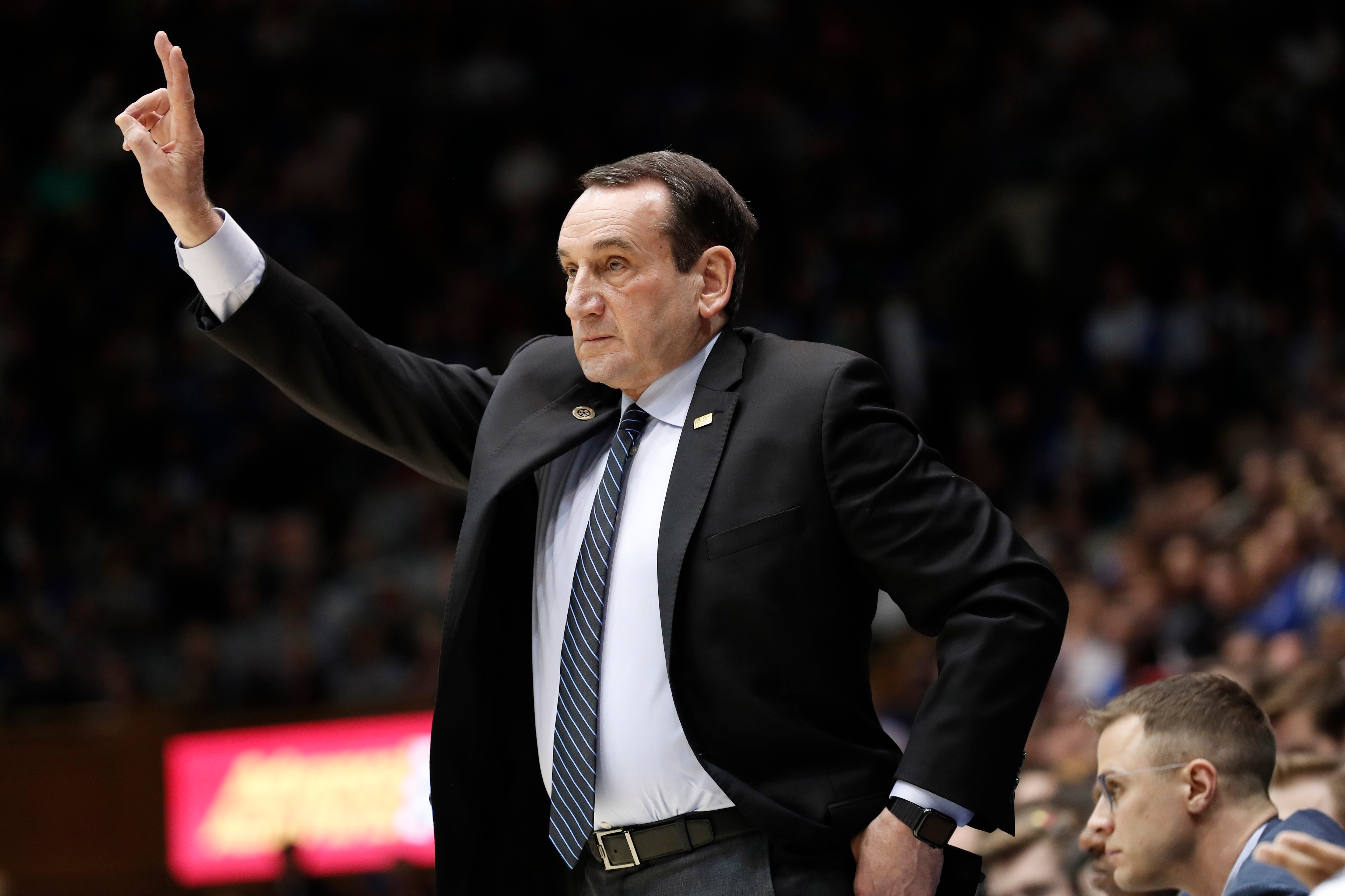 Duke head coach Mike Krzyzewski directs his players against North Carolina State during the first half of an NCAA college basketball game in Durham, N.C., Monday, March 2, 2020. (AP Photo/Gerry Broome)