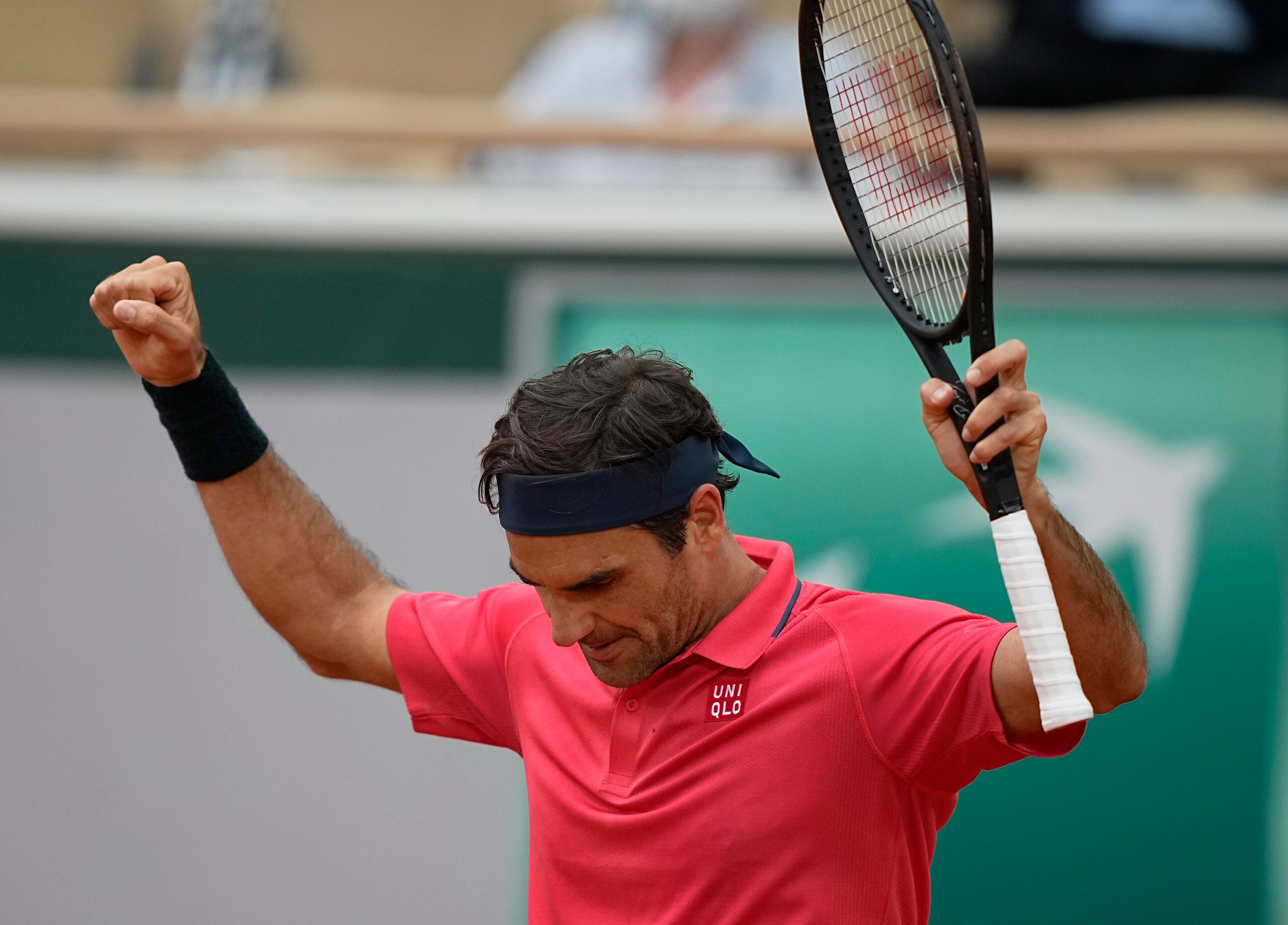 Switzerland's Roger Federer celebrates after defeating Croatia's Marin Cilic in their second round match on day 5, of the French Open tennis tournament at Roland Garros in Paris, France, Thursday, June 3, 2021. (AP Photo/Michel Euler)