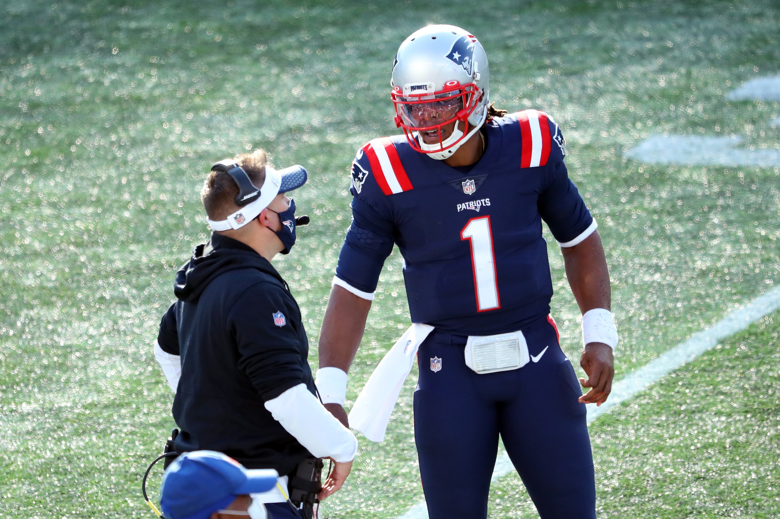 FOXBOROUGH, MASSACHUSETTS - OCTOBER 18: Offensive coordinator Josh McDaniels speaks with Cam Newton #1 of the New England Patriots during the second half against the Denver Broncos at Gillette Stadium on October 18, 2020 in Foxborough, Massachusetts. (Photo by Maddie Meyer/Getty Images)