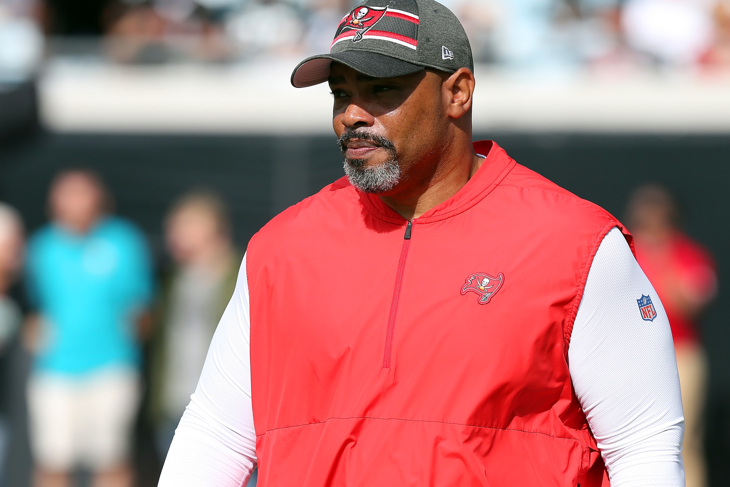 JACKSONVILLE, FL - DECEMBER 01: Bucs Assistant Head Coach/Run Game Coordinator Harold Goodwin walks onto the field before the regular season game between the Tampa Bay Buccaneers and the Jacksonville Jaguars on December 01, 2019 at TIAA Bank Field in Jacksonville, FL. (Photo by Cliff Welch/Icon Sportswire via Getty Images)