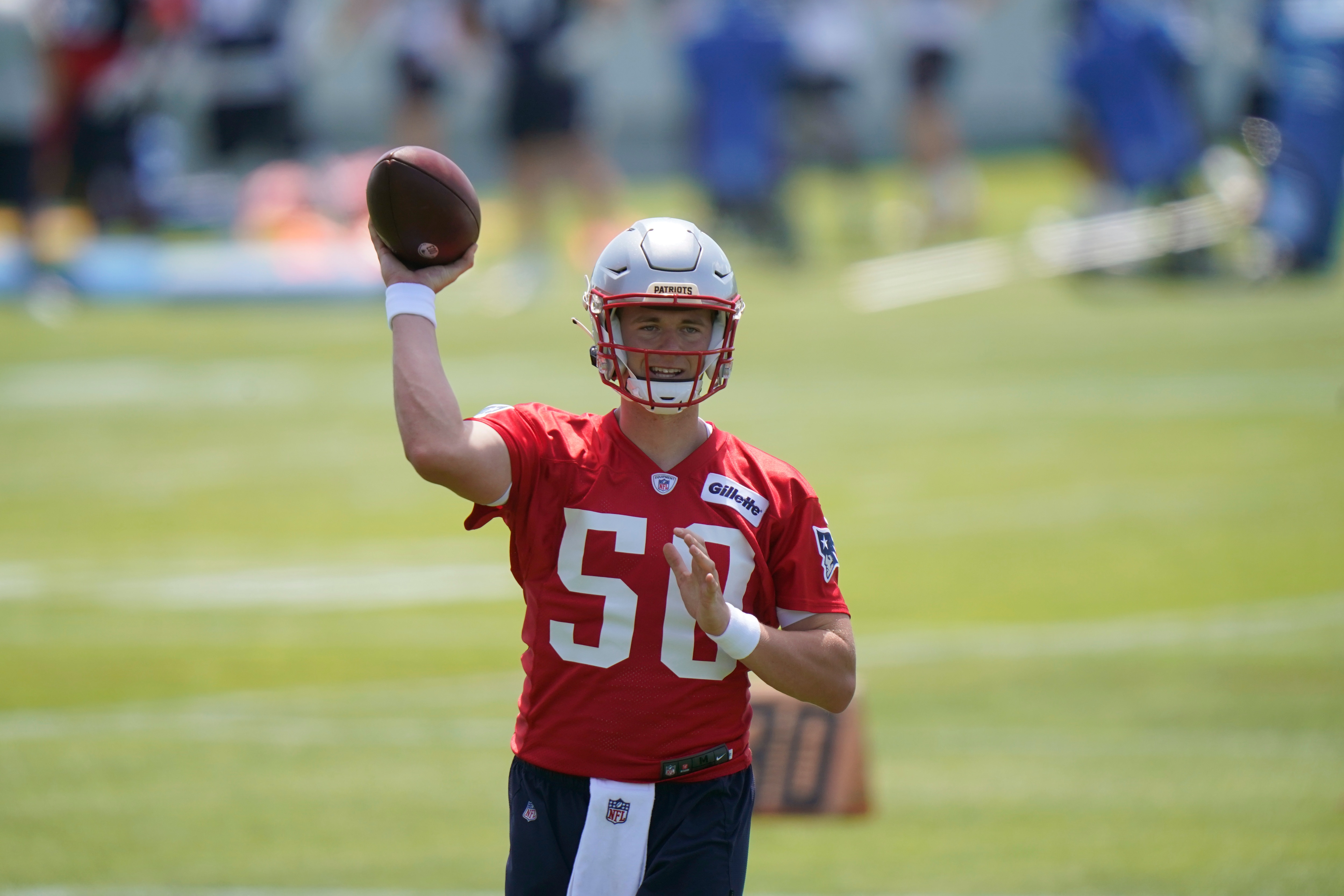 New England Patriots quarterback Mac Jones passes the ball during NFL football practice in Foxborough, Mass., Thursday, May 27, 2021. (AP Photo/Steven Senne)