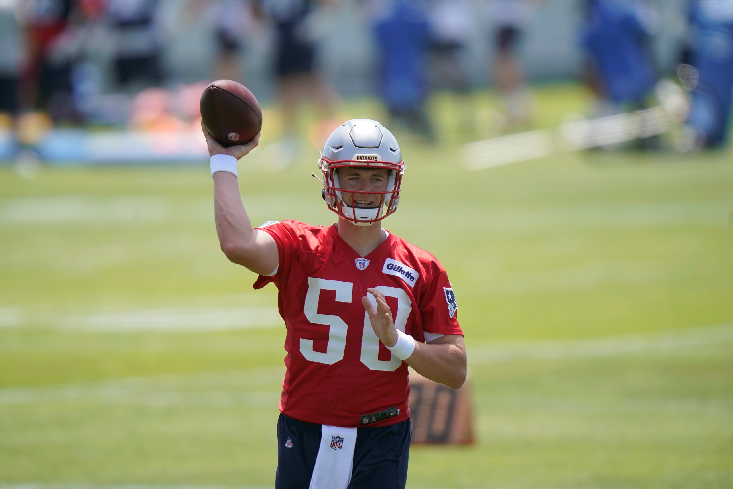 New England Patriots quarterback Mac Jones passes the ball during NFL football practice in Foxborough, Mass., Thursday, May 27, 2021. (AP Photo/Steven Senne)
