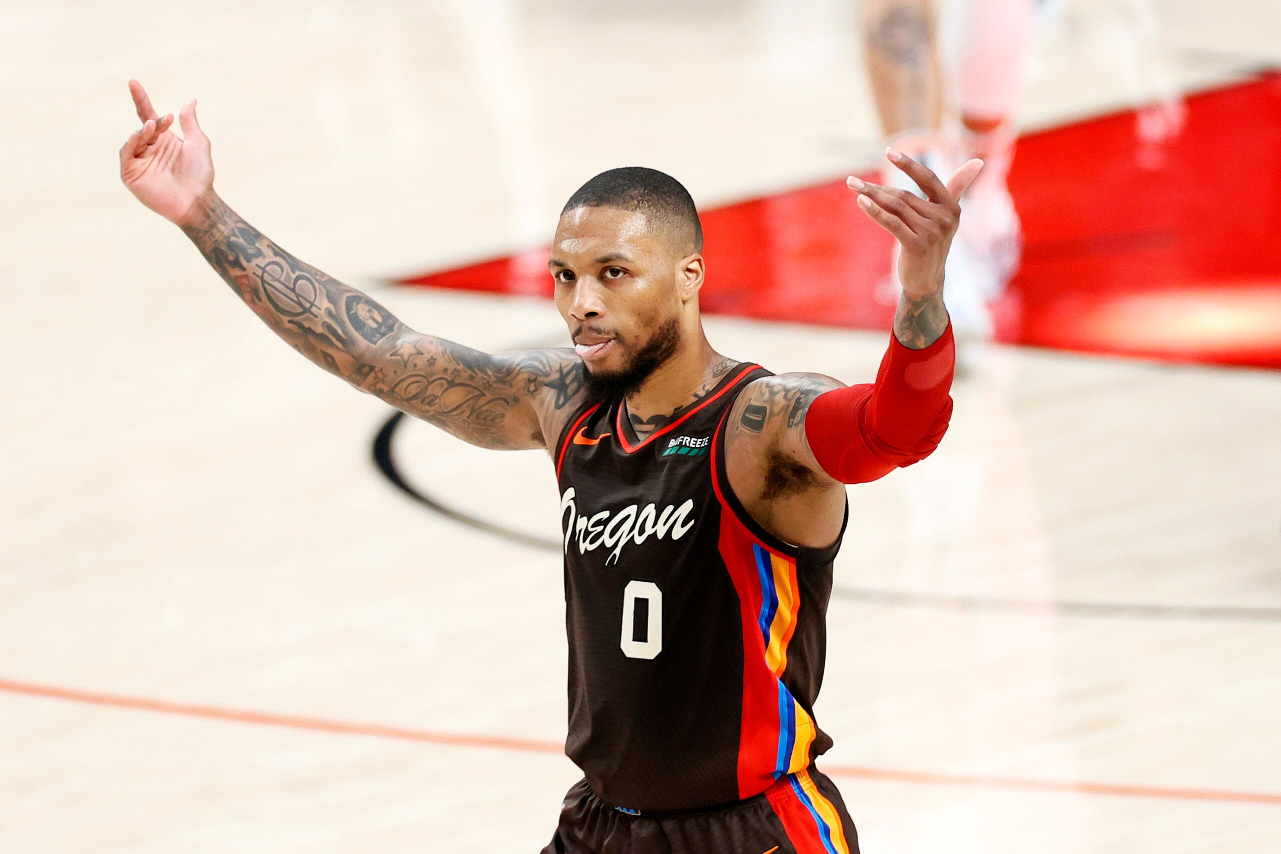 PORTLAND, OREGON - JUNE 03: Damian Lillard #0 of the Portland Trail Blazers reacts after his three point basket in the second quarter against the Denver Nuggets during Round 1, Game 6 of the 2021 NBA Playoffs at Moda Center on June 03, 2021 in Portland, Oregon. NOTE TO USER: User expressly acknowledges and agrees that, by downloading and or using this photograph, User is consenting to the terms and conditions of the Getty Images License Agreement. (Photo by Steph Chambers/Getty Images)