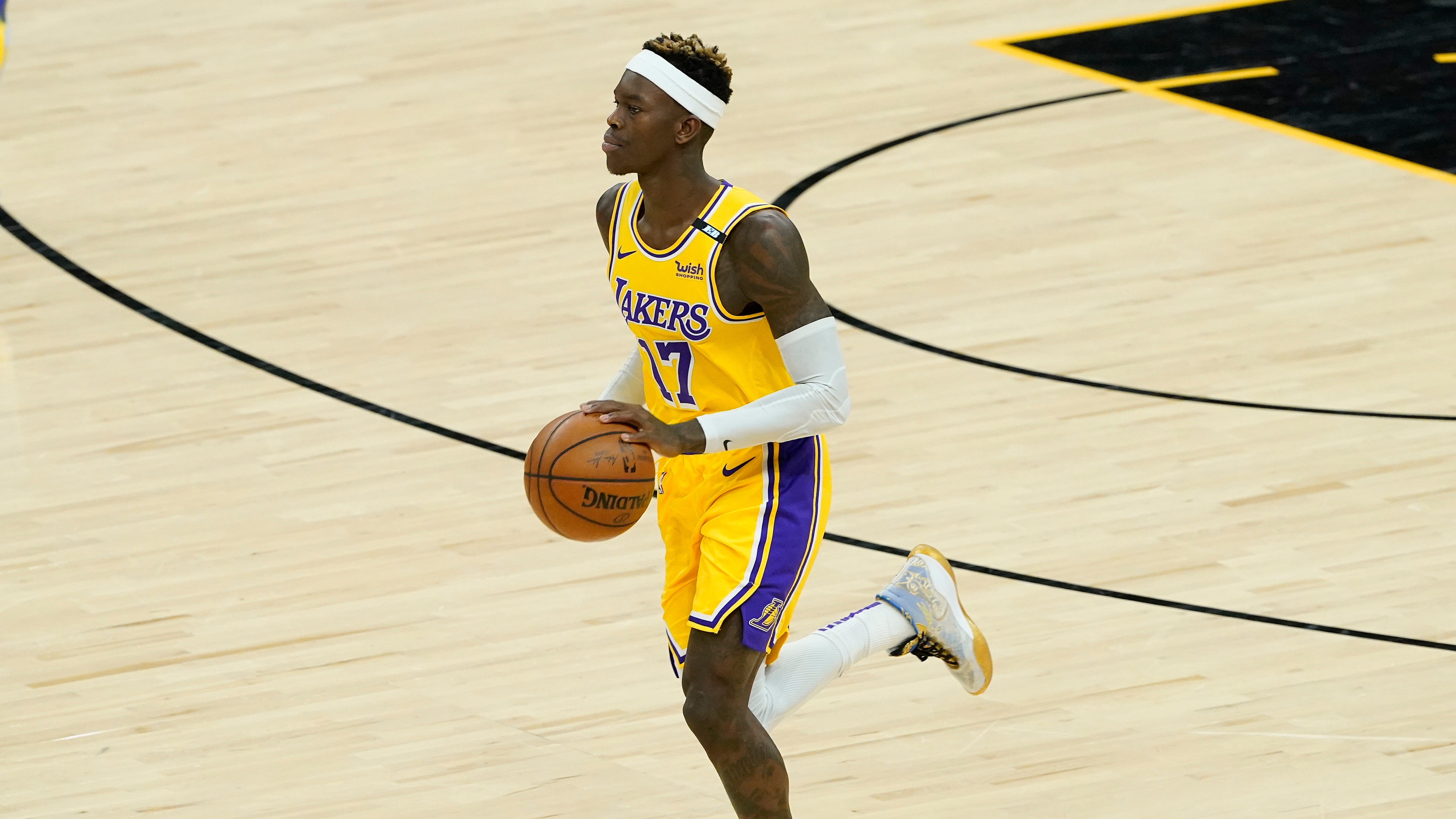 Los Angeles Lakers guard Dennis Schroder (17) against the Phoenix Suns during the first half of Game 5 of an NBA basketball first-round playoff series against the Phoenix Suns, Tuesday, June 1, 2021, in Phoenix. (AP Photo/Matt York)