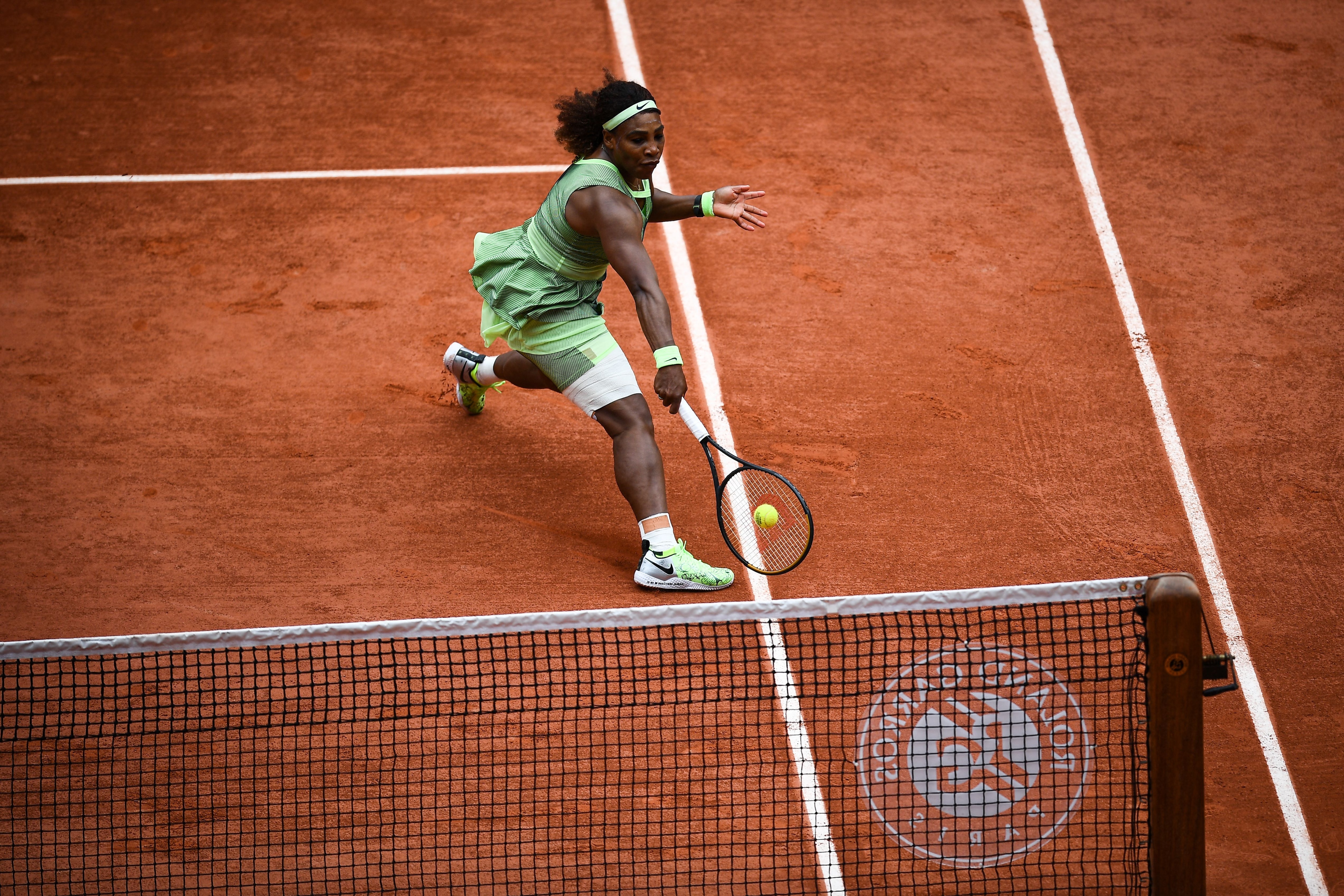 Serena Williams of the US returns the ball to Danielle Collins of the US during their women's singles third round tennis match on Day 6 of The Roland Garros 2021 French Open tennis tournament in Paris on June 4, 2021. (Photo by Christophe ARCHAMBAULT / AFP) (Photo by CHRISTOPHE ARCHAMBAULT/AFP via Getty Images)