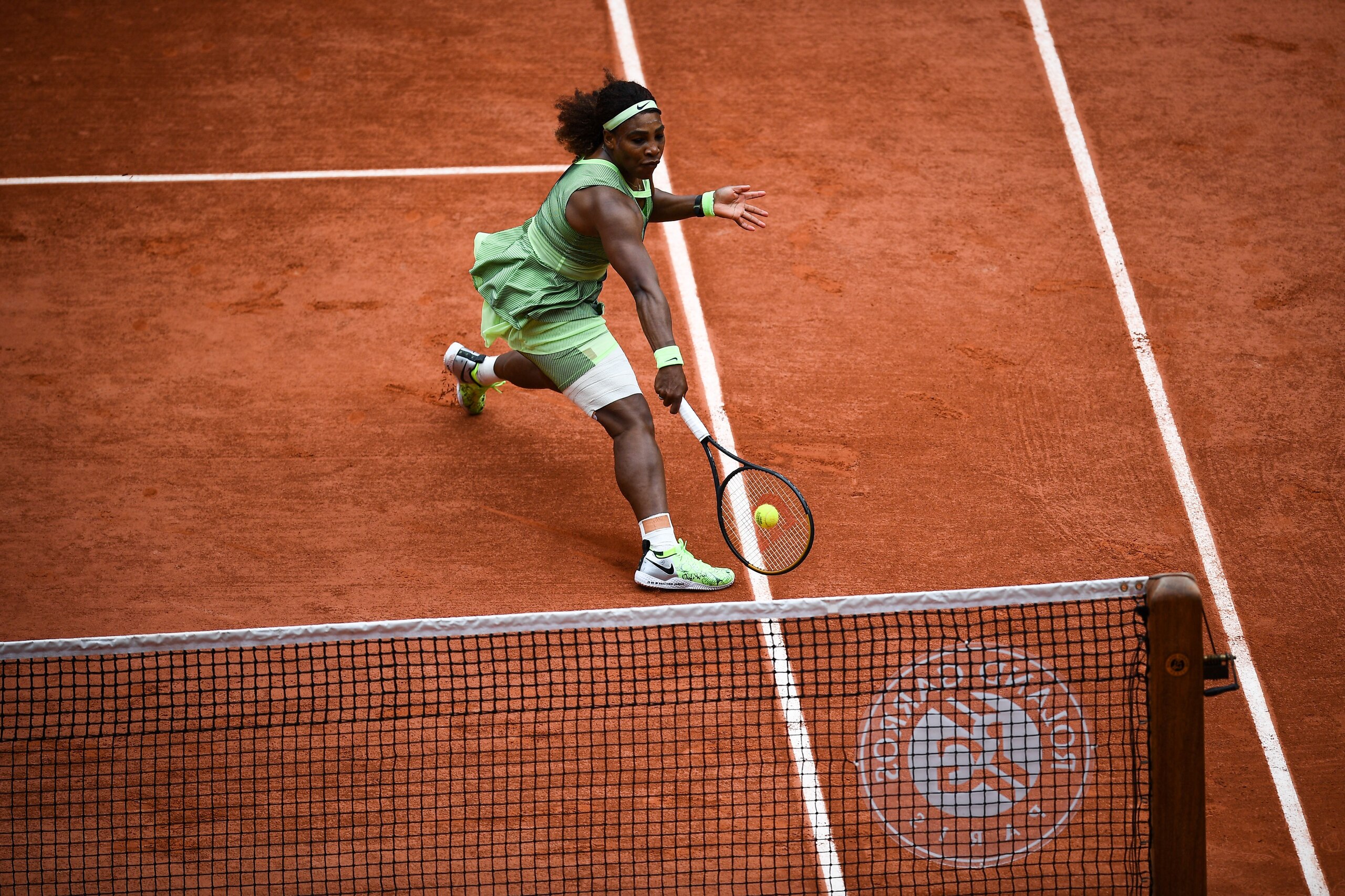 Serena Williams of the US returns the ball to Danielle Collins of the US during their women's singles third round tennis match on Day 6 of The Roland Garros 2021 French Open tennis tournament in Paris on June 4, 2021. (Photo by Christophe ARCHAMBAULT / AFP) (Photo by CHRISTOPHE ARCHAMBAULT/AFP via Getty Images)