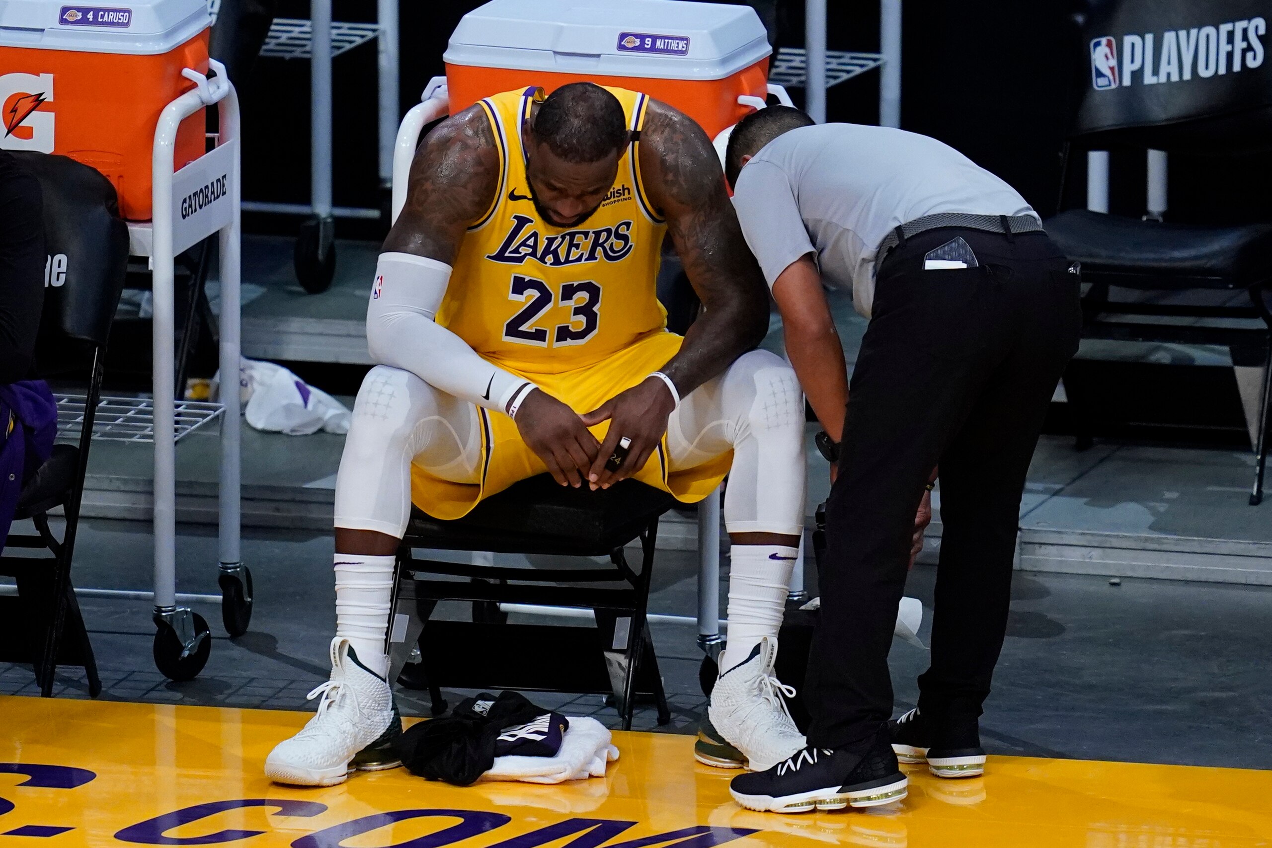 Los Angeles Lakers forward LeBron James (23) sit on the bench during the fourth quarter of Game 6 of an NBA basketball first-round playoff series against the Phoenix Suns Thursday, June 3, 2021, in Los Angeles. The Suns won the game 113-100, and the series 4-2. They will move on to round 2. (AP Photo/Ashley Landis) Los Angeles Lakers forward LeBron James (23) sit on the bench during the fourth quarter of Game 6 of an NBA basketball first-round playoff series against the Phoenix Suns Thursday, June 3, 2021, in Los Angeles. The Suns won the game 113-100, and the series 4-2. They will move on to round 2. (AP Photo/Ashley Landis)