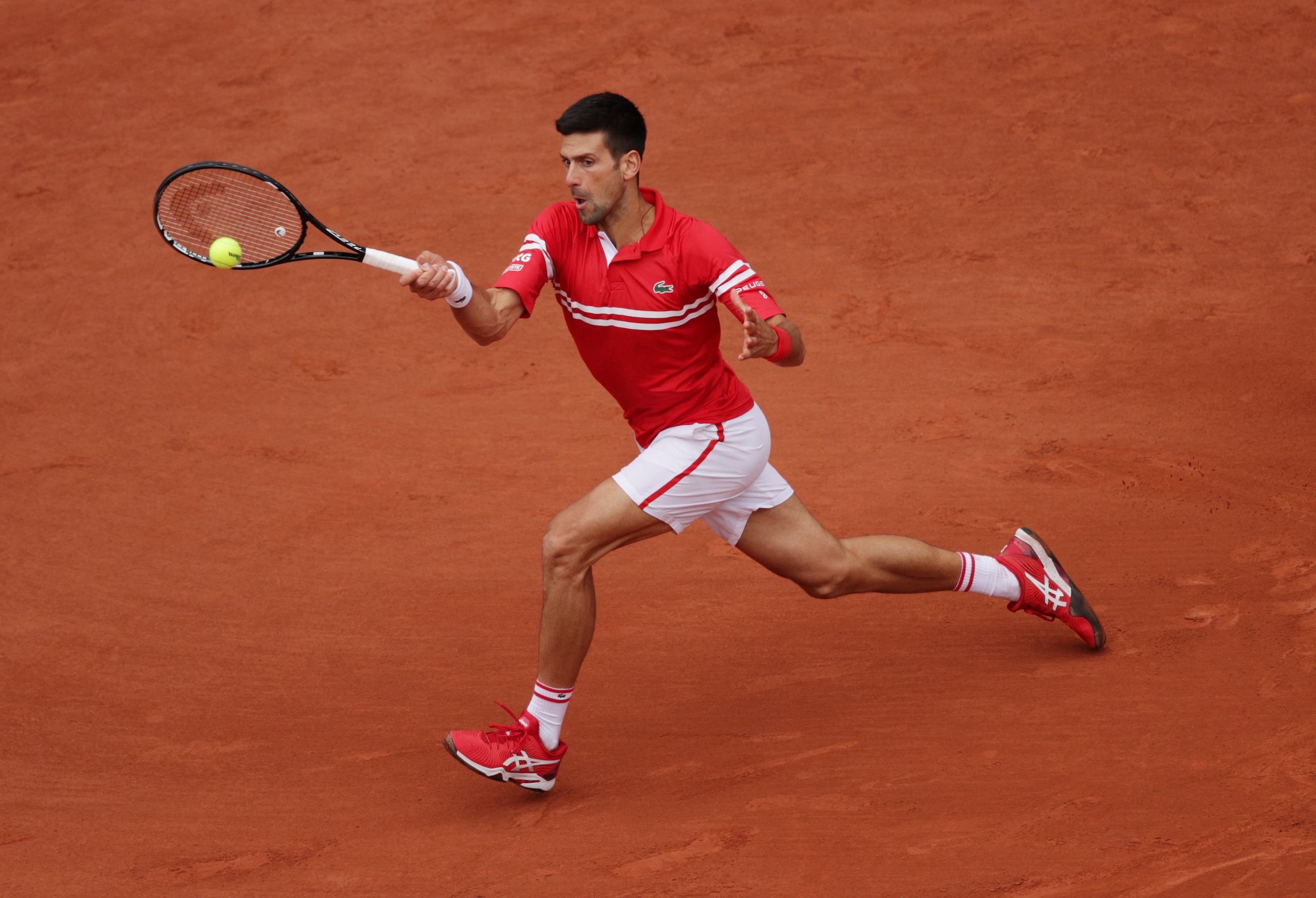 PARIS, FRANCE - JUNE 05: Novak Djokovic of Serbia plays a forehand during his Men's Singles third round match against Ricardas Berankis of Lithuania on day seven of the 2021 French Open at Roland Garros on June 05, 2021 in Paris, France. (Photo by Adam Pretty/Getty Images)