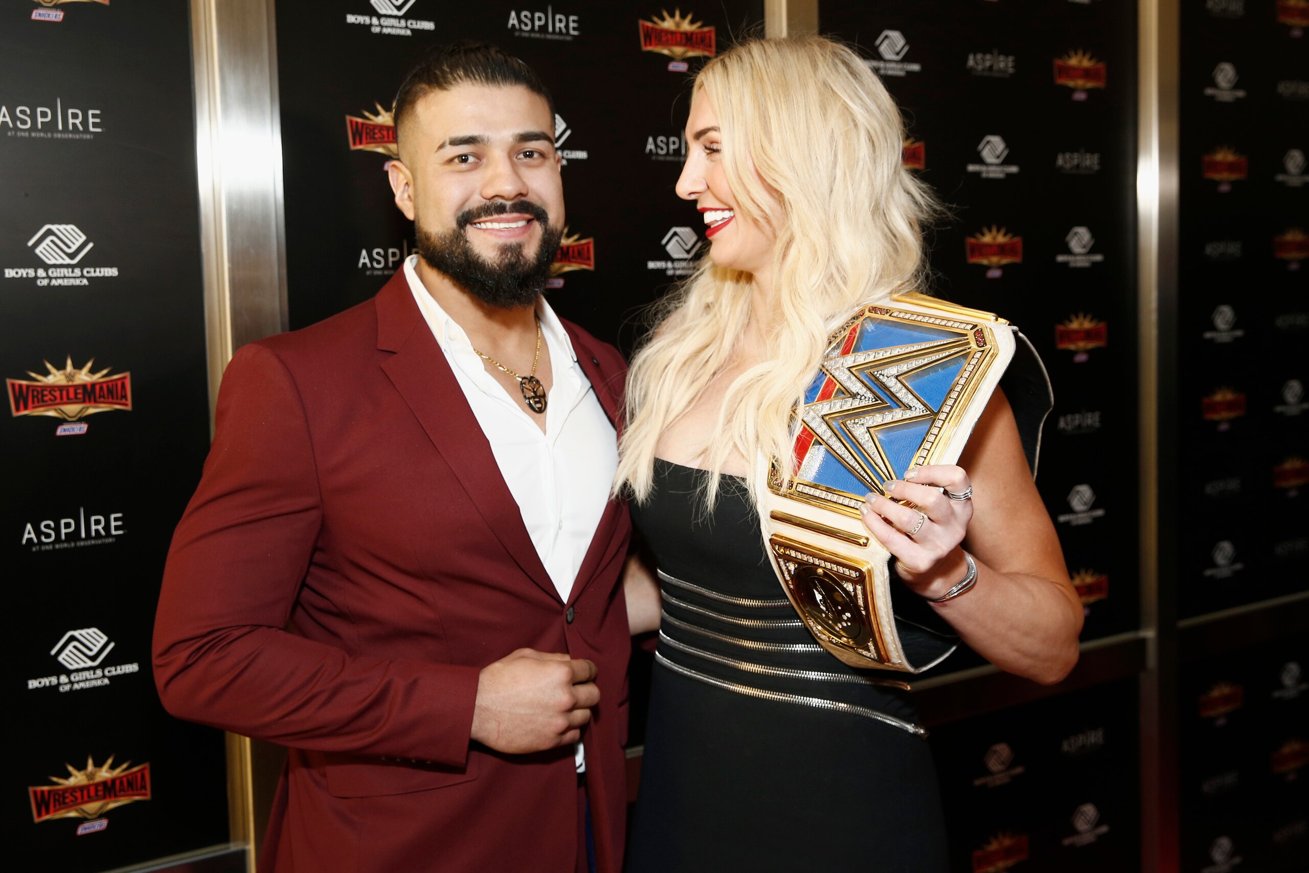 NEW YORK, NEW YORK - APRIL 05: WWE Superstars Andrade and Charlotte Flair attend the WWE Superstars For Hope Reception on April 05, 2019 in New York City. (Photo by Brian Ach/Getty Images for WWE)