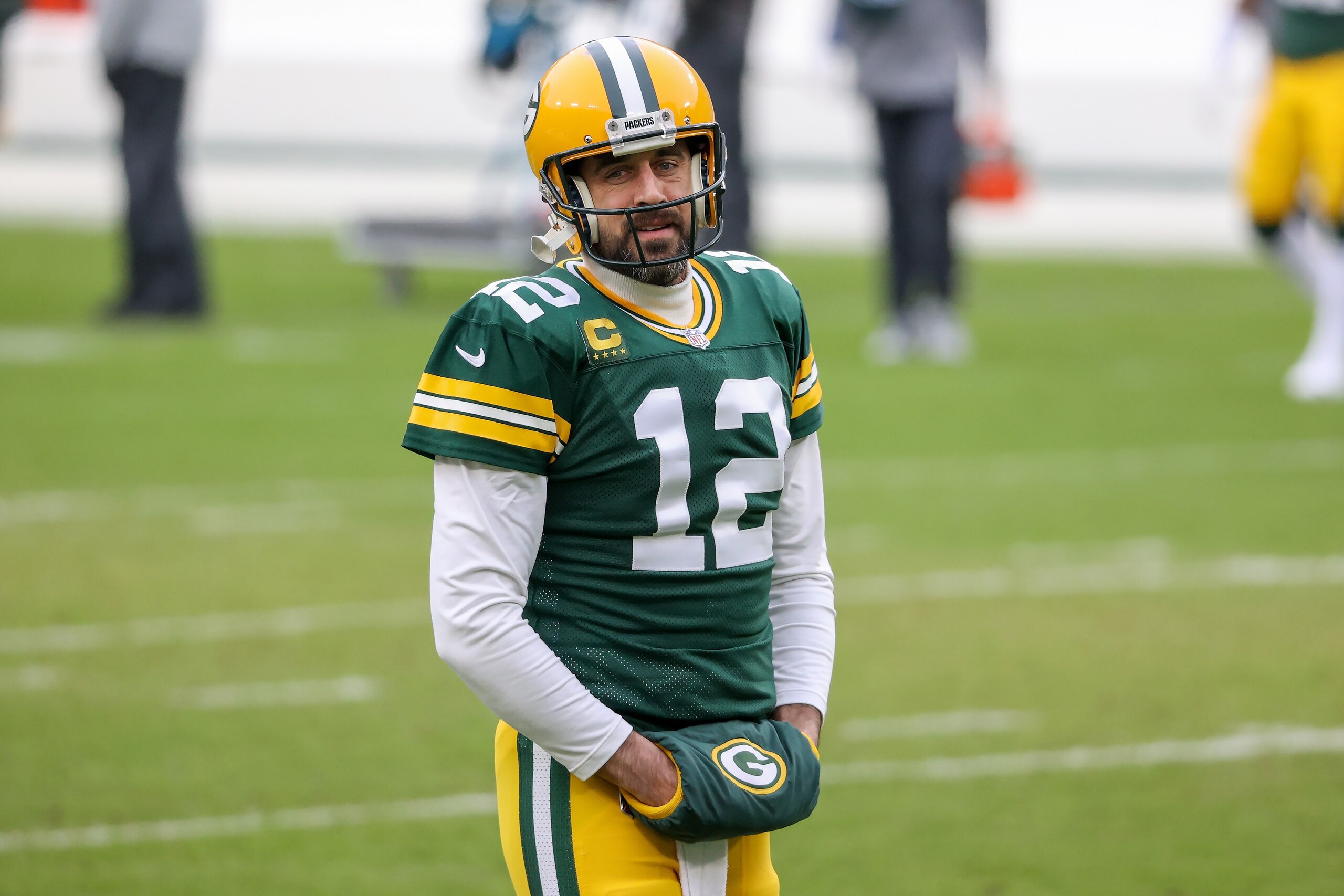 GREEN BAY, WISCONSIN - JANUARY 24: Aaron Rodgers #12 of the Green Bay Packers warms up before the NFC Championship game against the Tampa Bay Buccaneers at Lambeau Field on January 24, 2021 in Green Bay, Wisconsin. (Photo by Dylan Buell/Getty Images)