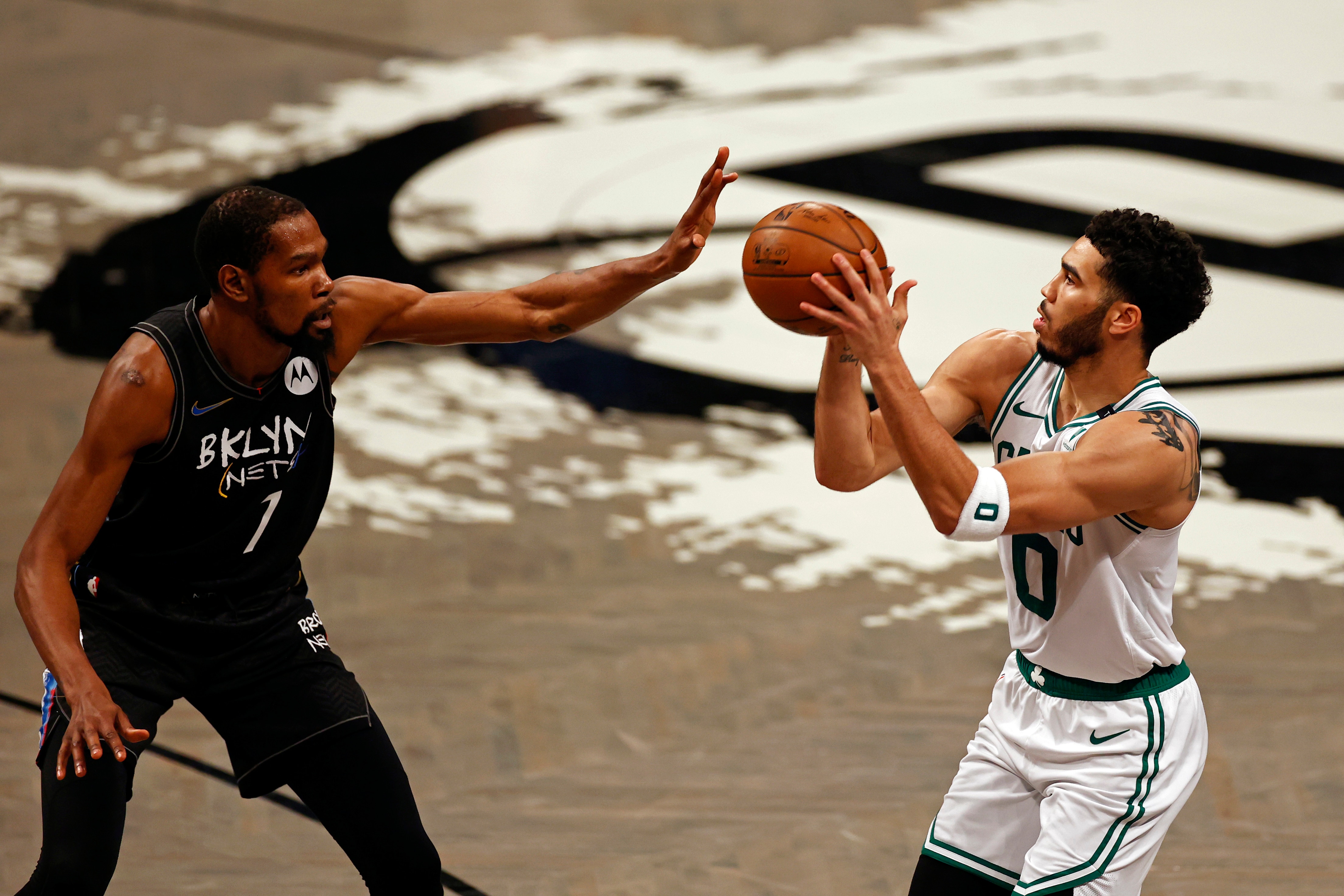 Boston Celtics forward Jayson Tatum (0) looks to shoot while being defended by Brooklyn Nets forward Kevin Durant in the first half of Game 5 during an NBA basketball first-round playoff series, Tuesday, June 1, 2021, in New York. (AP Photo/Adam Hunger)