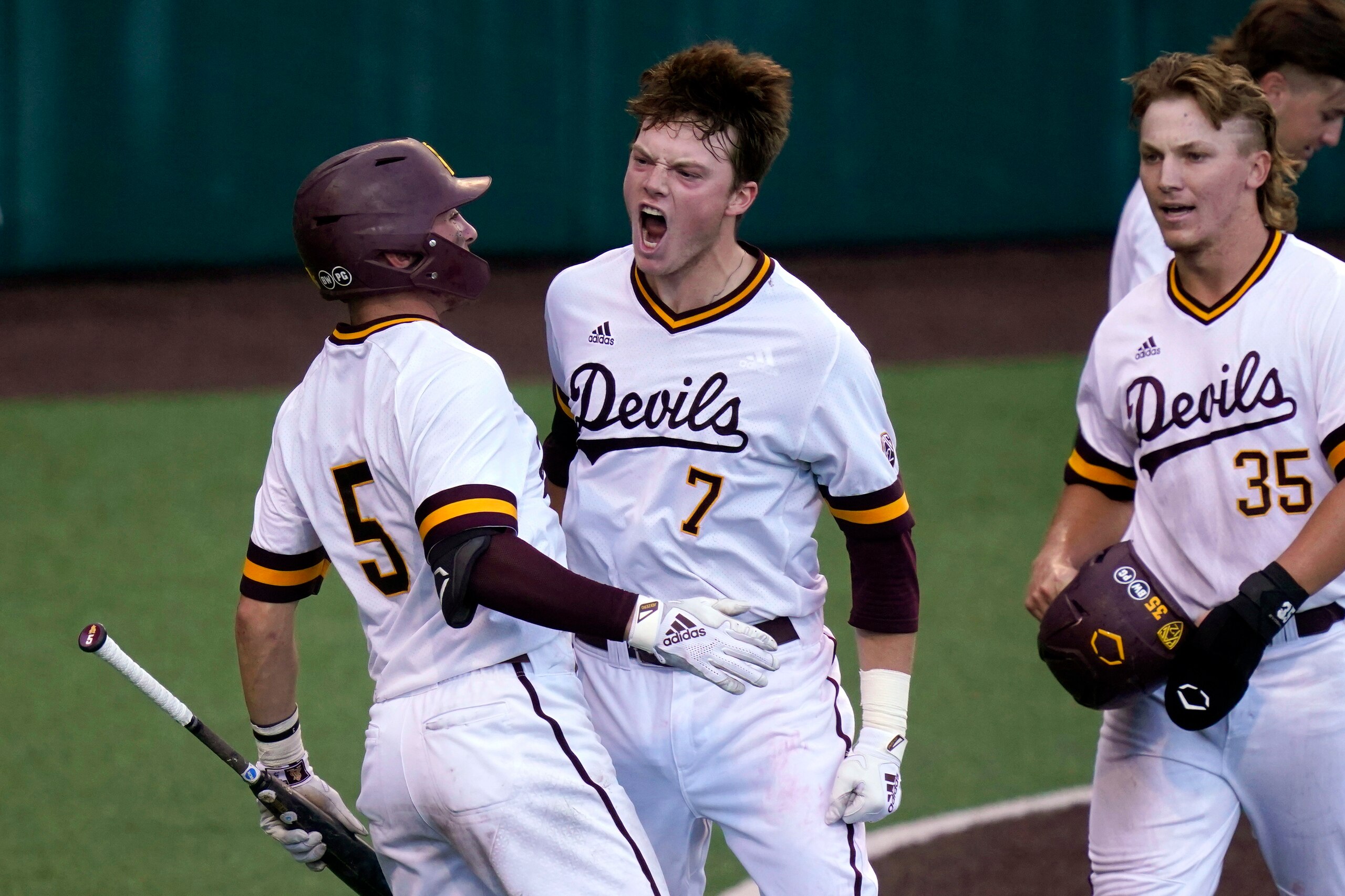 Arizona State's Jack Moss (7) celebrates his two-run home run against Fairfield in the fourth inning of Game 2 of the NCAA college baseball regional tournament, Friday, June 4, 2021, in Austin, Texas. (AP Photo/Eric Gay)