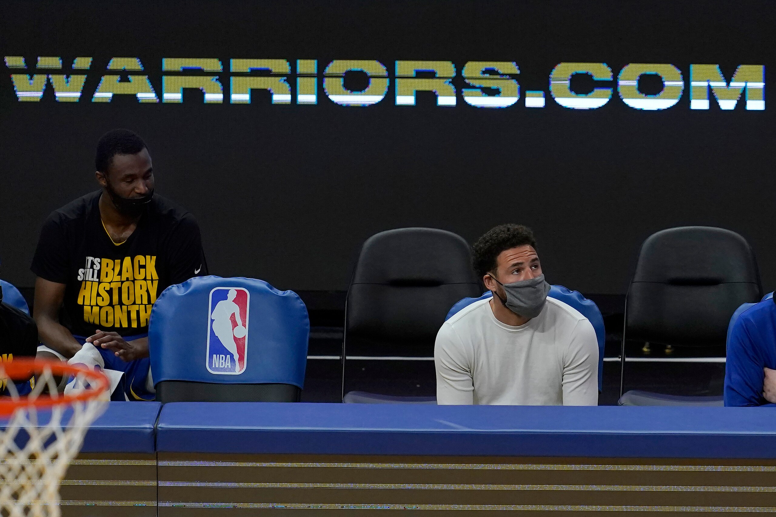 Golden State Warriors' Andrew Wiggins, left, and Klay Thompson watch during an NBA basketball game against the Dallas Mavericks in San Francisco, Tuesday, April 27, 2021. (AP Photo/Jeff Chiu) Golden State Warriors' Andrew Wiggins, left, and Klay Thompson watch during an NBA basketball game against the Dallas Mavericks in San Francisco, Tuesday, April 27, 2021. (AP Photo/Jeff Chiu)