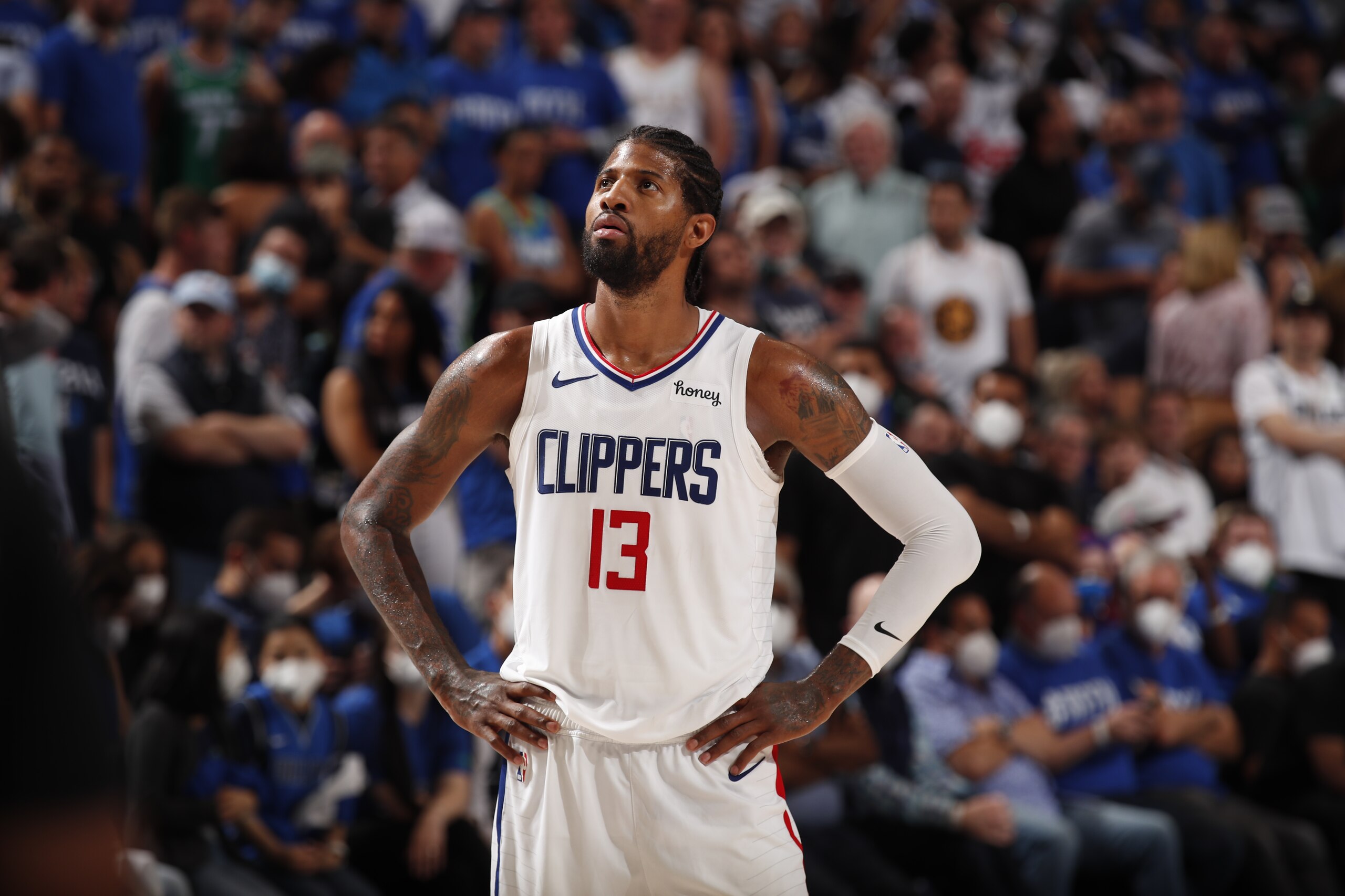 DALLAS, TX - JUNE 4: Paul George #13 of the LA Clippers looks on during the game against the Dallas Mavericks during Round 1, Game 6 of the 2021 NBA Playoffs on June 4, 2021 at the American Airlines Center in Dallas, Texas. NOTE TO USER: User expressly acknowledges and agrees that, by downloading and or using this photograph, User is consenting to the terms and conditions of the Getty Images License Agreement. Mandatory Copyright Notice: Copyright 2021 NBAE (Photo by Jeff Haynes/NBAE via Getty Images)