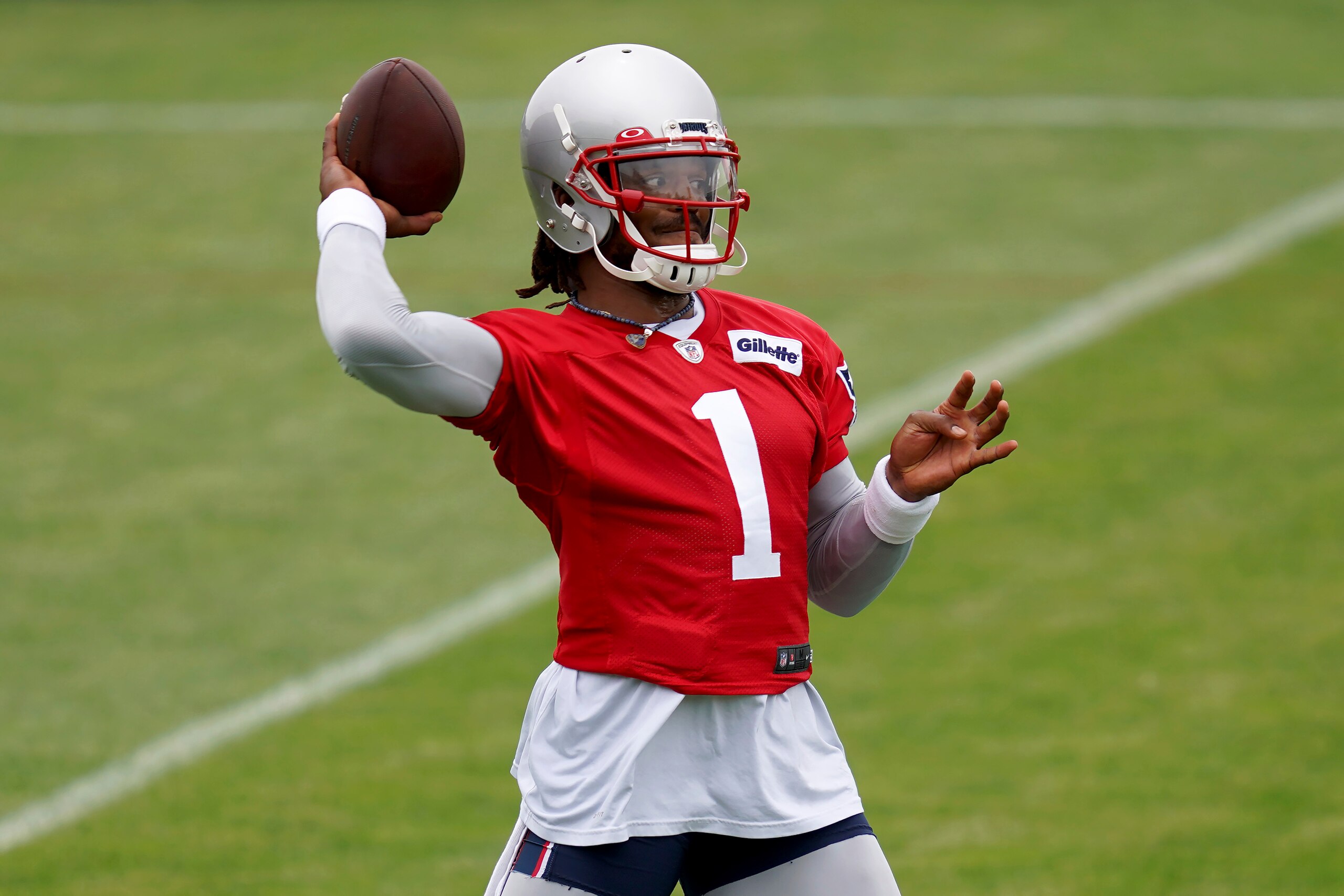 New England Patriots quarterback Cam Newton throws a pass during NFL football practice in Foxborough, Mass., Friday, June 4, 2021. (AP Photo/Mary Schwalm) New England Patriots quarterback Cam Newton throws a pass during NFL football practice in Foxborough, Mass., Friday, June 4, 2021. (AP Photo/Mary Schwalm)