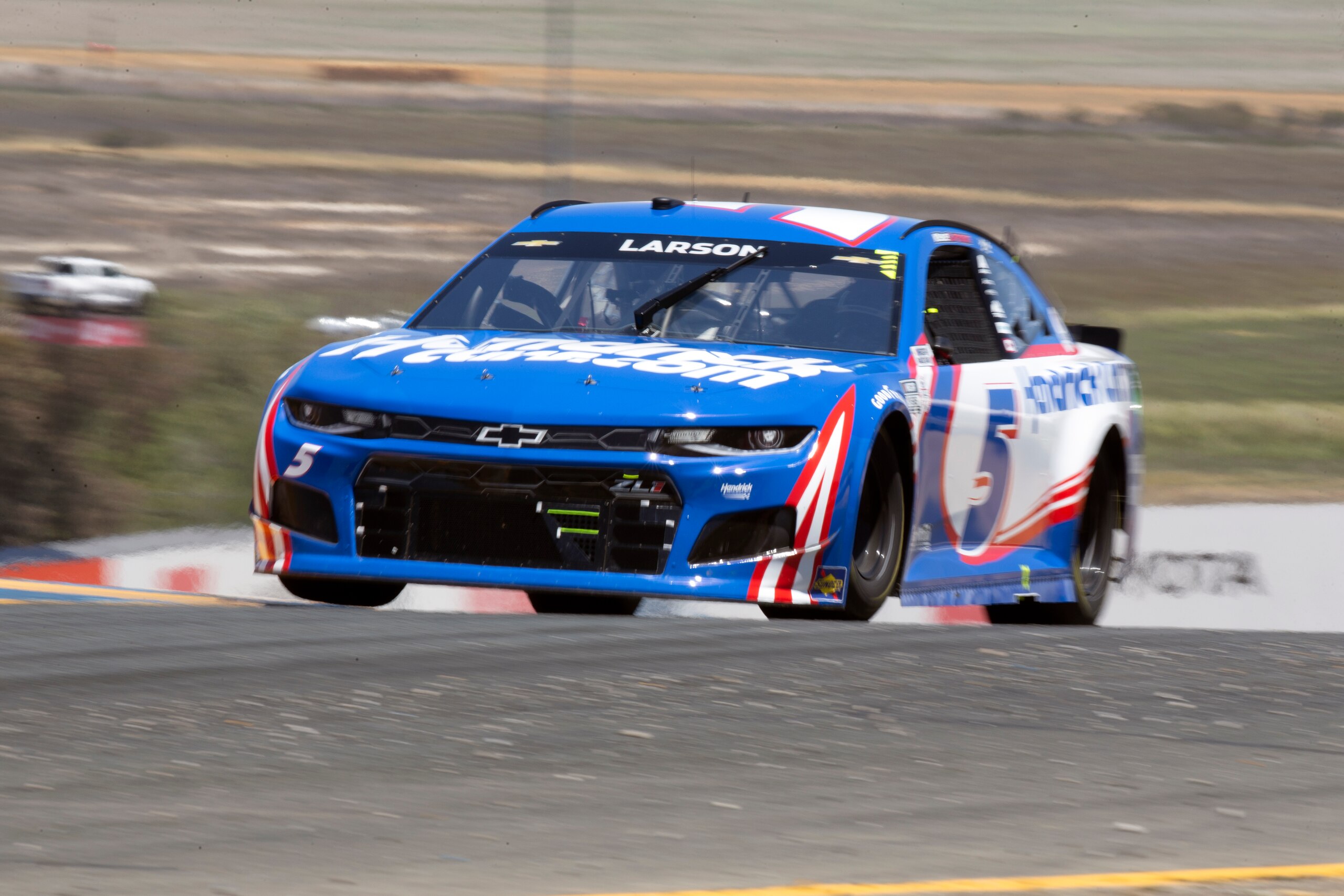 Kyle Larson speeds through turn 2 during a NASCAR Cup Series race, Sunday, June 6, 2021, at Sonoma Raceway in Sonoma, Calif. Larson won the first and second stages of the 350-mile race. (AP Photo/D. Ross Cameron)