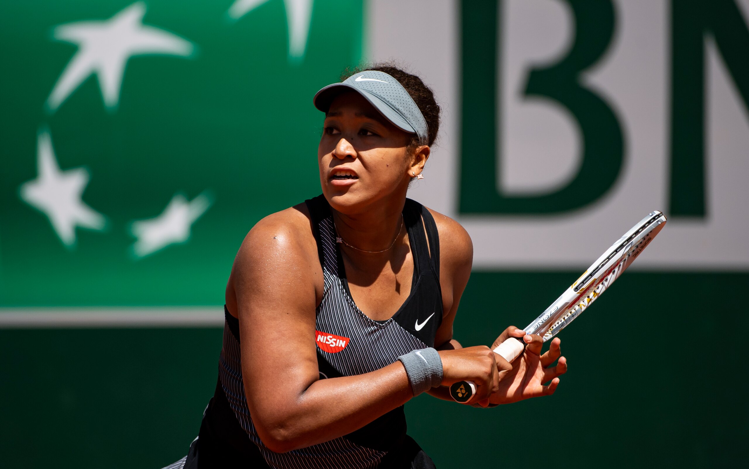 PARIS, FRANCE - MAY 30: Naomi Osaka of Japan hits a forehand against Patricia Maria Èig of Romania in the first round of the women’s singles at Roland Garros on May 30, 2021 in Paris, France.