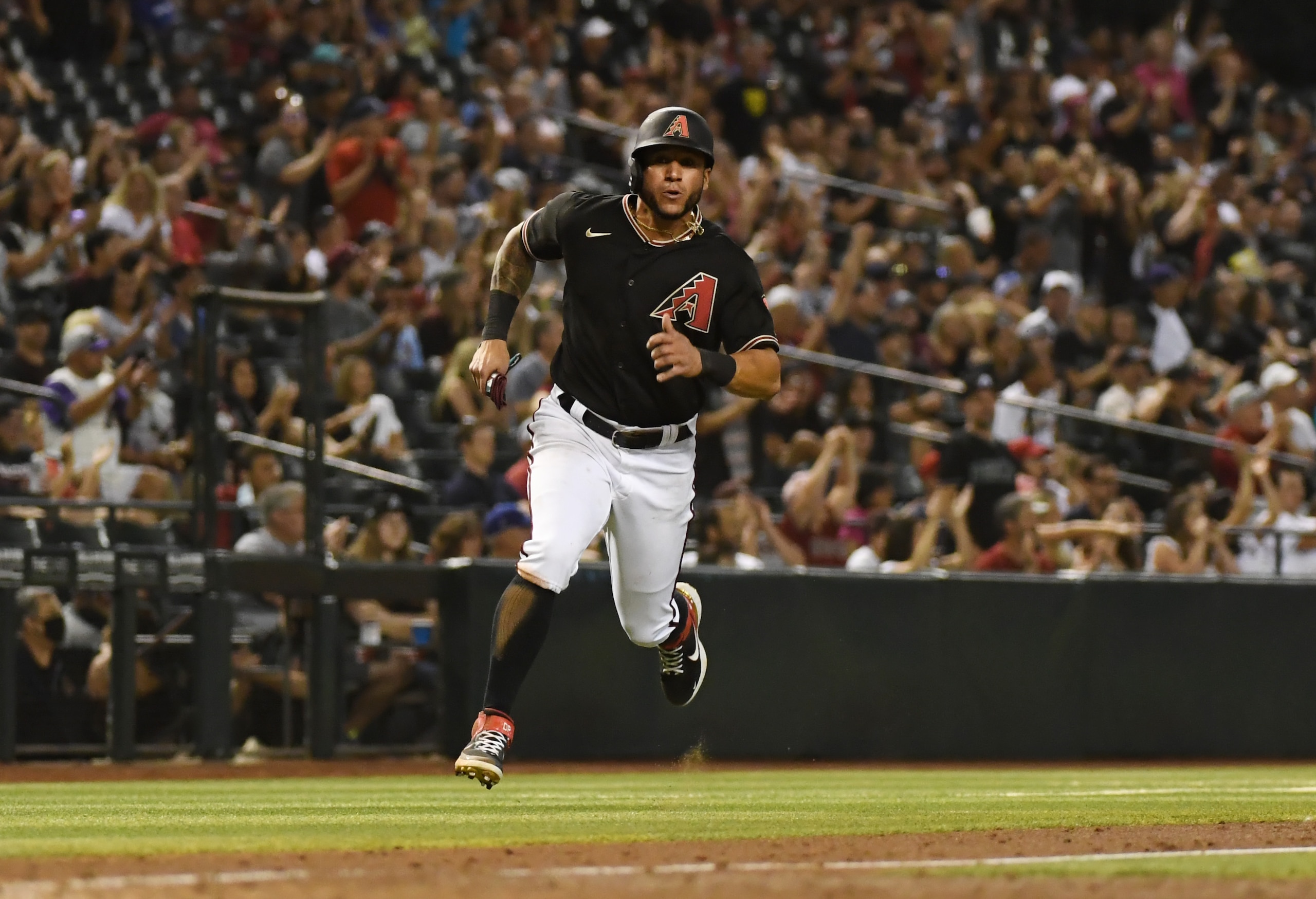 PHOENIX, ARIZONA - MAY 29: David Peralta #6 of the Arizona Diamondbacks rounds third base and runs to home plate against the St Louis Cardinals at Chase Field on May 29, 2021 in Phoenix, Arizona. (Photo by Norm Hall/Getty Images)