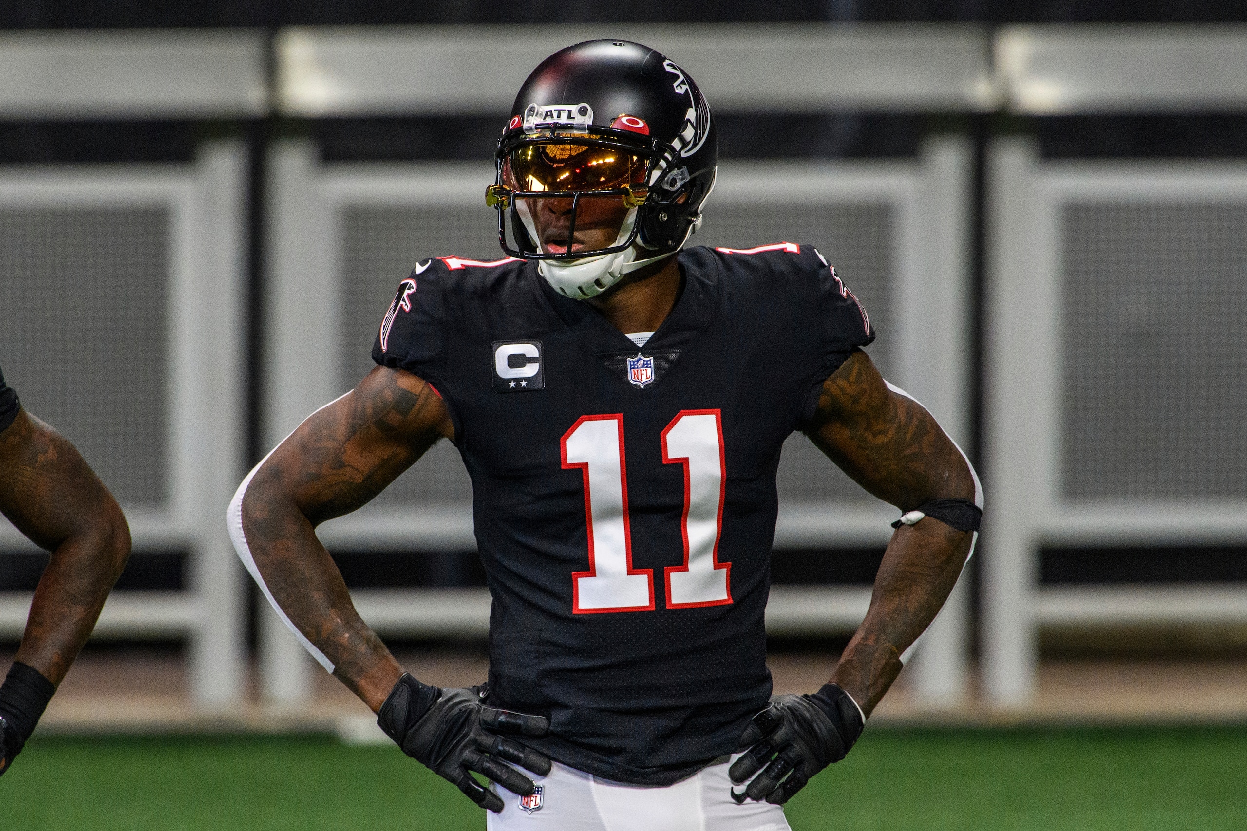 FILE - In this Sunday, Dec. 6, 2020, file photo, Atlanta Falcons wide receiver Julio Jones (11) warms up before an NFL football game against the New Orleans Saints in Atlanta. The Atlanta Falcons began their offseason training program Tuesday, May 25, 2021, without longtime star receiver Julio Jones, who apparently has no intention of returning to a rebuilding team that is still struggling to get under the salary cap. (AP Photo/Danny Karnik, File)