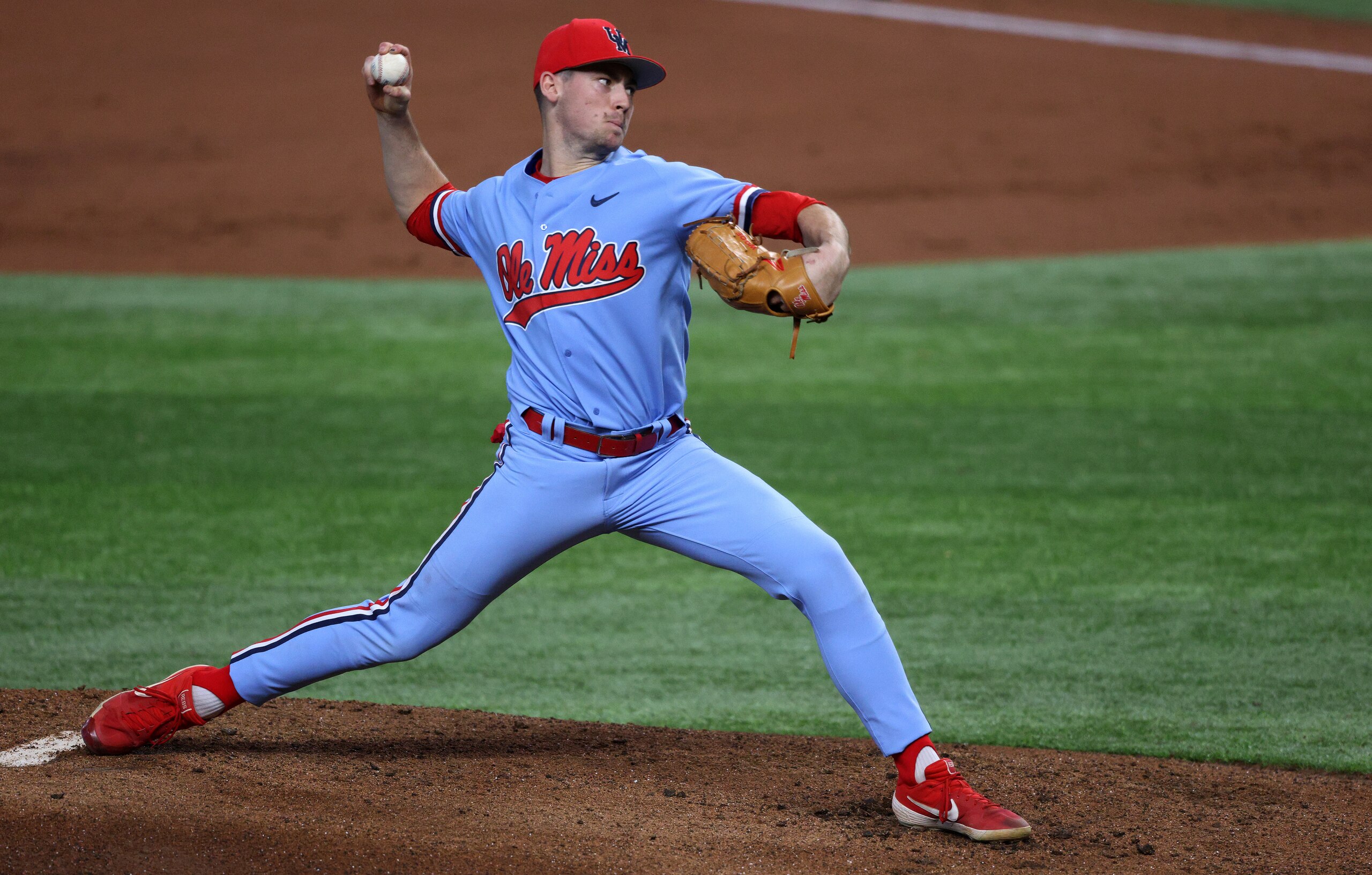 ARLINGTON, TEXAS - FEBRUARY 22:   Derek Diamond #2 of the Mississippi Rebels throws against the Texas Longhorns in the first inning during the 2021 State Farm College Baseball Showdown at Globe Life Field on February 22, 2021 in Arlington, Texas. (Photo by Ronald Martinez/Getty Images)