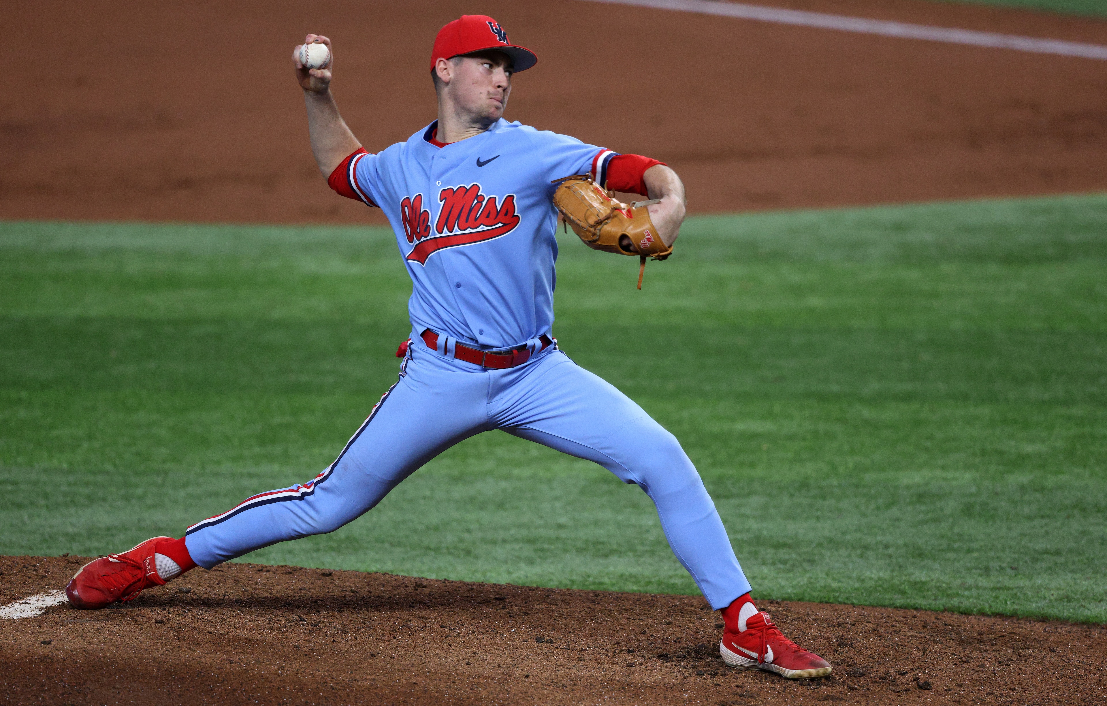 ARLINGTON, TEXAS - FEBRUARY 22:   Derek Diamond #2 of the Mississippi Rebels throws against the Texas Longhorns in the first inning during the 2021 State Farm College Baseball Showdown at Globe Life Field on February 22, 2021 in Arlington, Texas. (Photo by Ronald Martinez/Getty Images)