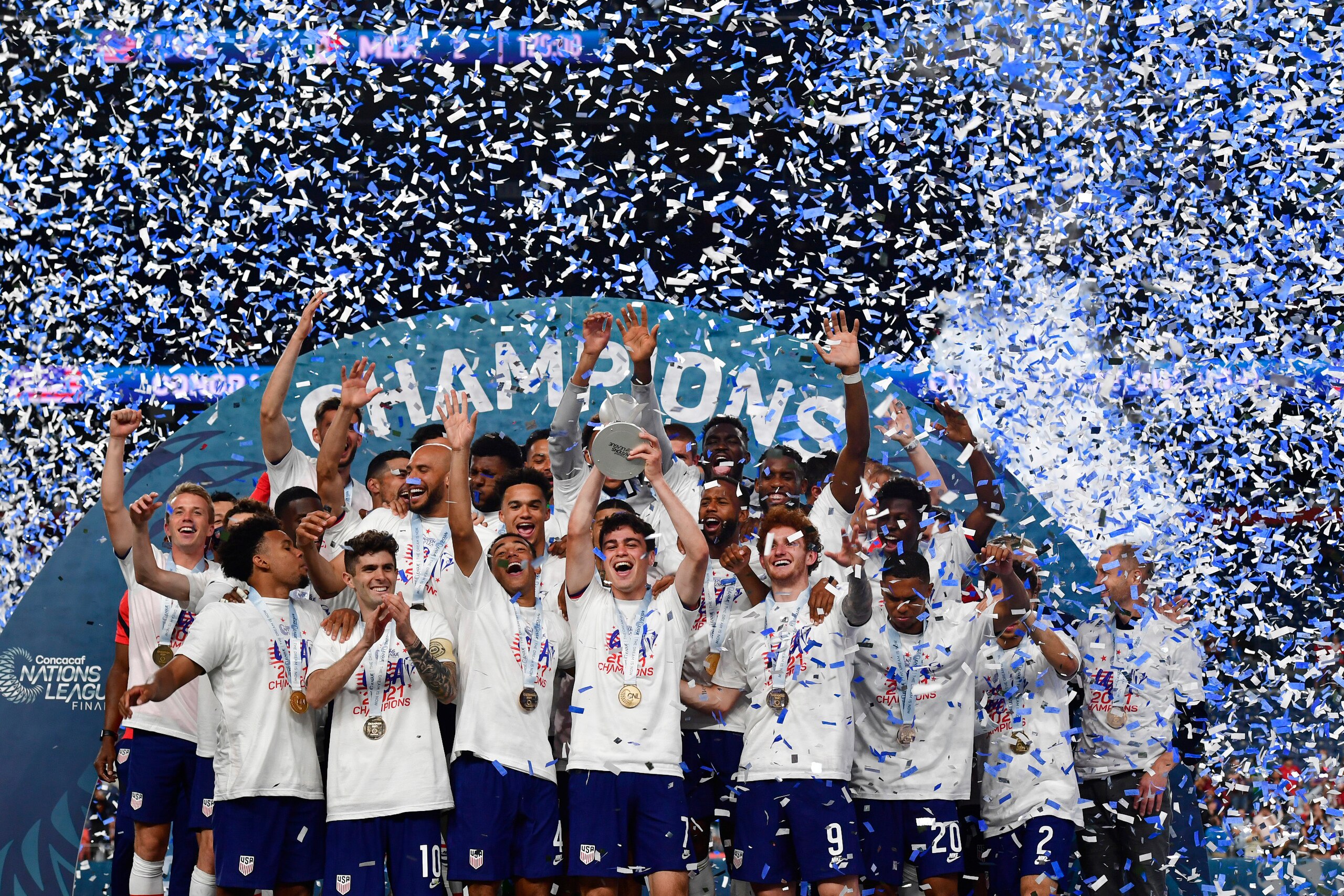 DENVER, COLORADO - MAY 6: United States players celebrate their win over Mexico as forward Gio Reyna, #7, center, holds up the CONCACAF Nations League Championship trophy after beating Mexico in the championship game of the CONCACAF Nations League Finals at Empower Field at Mile High on June 6, 2021 in Denver, Colorado. The United States beat Mexico 3 to 2 in a heated game that lasted over two hours. (Photo by Helen H. Richardson/MediaNews Group/The Denver Post via Getty Images) DENVER, COLORADO - MAY 6: United States players celebrate their win over Mexico as forward Gio Reyna, #7, center, holds up the CONCACAF Nations League Championship trophy after beating Mexico in the championship game of the CONCACAF Nations League Finals at Empower Field at Mile High on June 6, 2021 in Denver, Colorado. The United States beat Mexico 3 to 2 in a heated game that lasted over two hours. (Photo by Helen H. Richardson/MediaNews Group/The Denver Post via Getty Images)