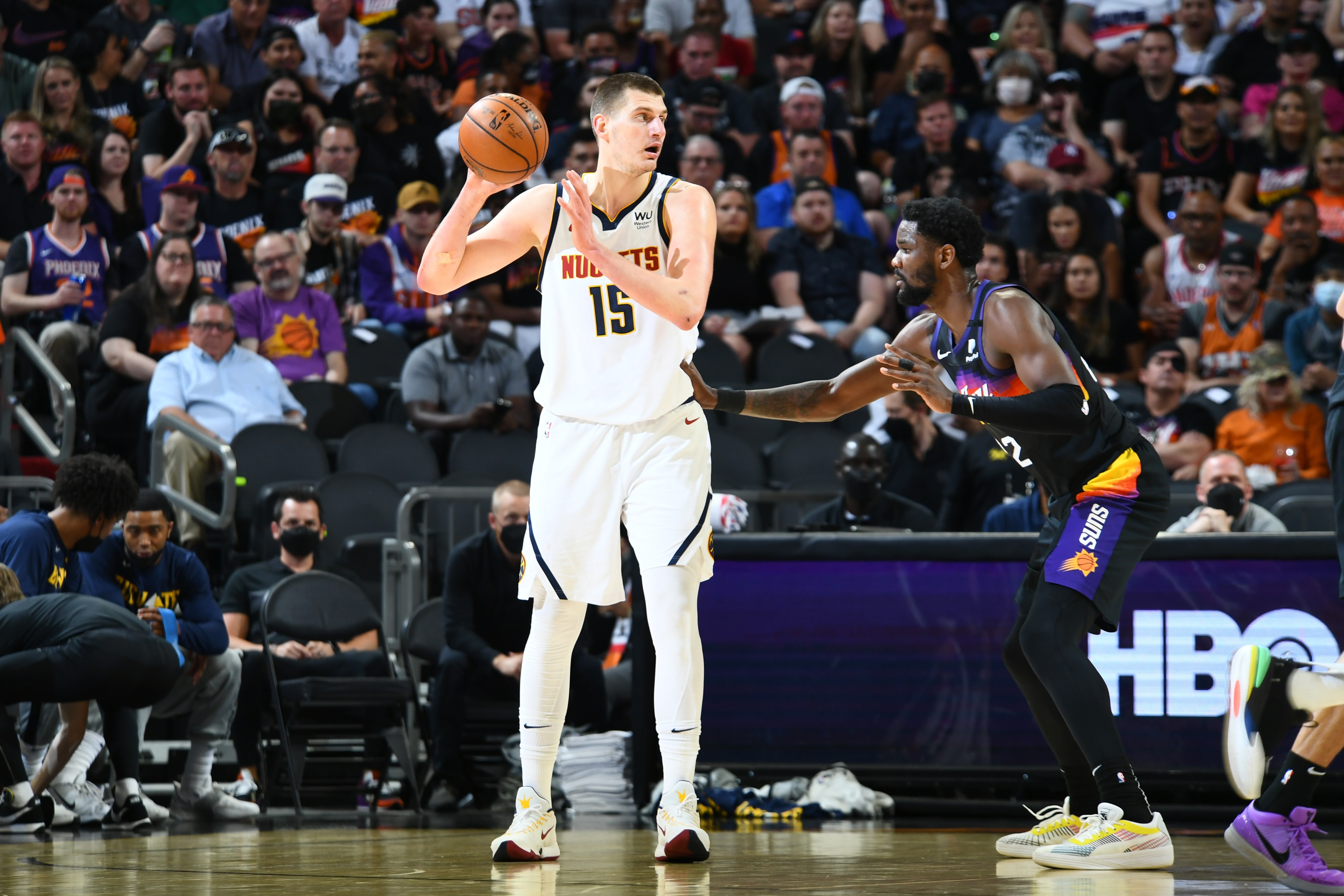 PHOENIX, AZ - JUNE 7: Deandre Ayton #22 of the Phoenix Suns plays defense on Nikola Jokic #15 of the Denver Nuggets during Round 2, Game 1 of the 2021 NBA Playoffs on June 7, 2021 at Talking Stick Resort Arena in Phoenix, Arizona. NOTE TO USER: User expressly acknowledges and agrees that, by downloading and or using this photograph, user is consenting to the terms and conditions of the Getty Images License Agreement. Mandatory Copyright Notice: Copyright 2021 NBAE (Photo by Michael Gonzales/NBAE via Getty Images)
