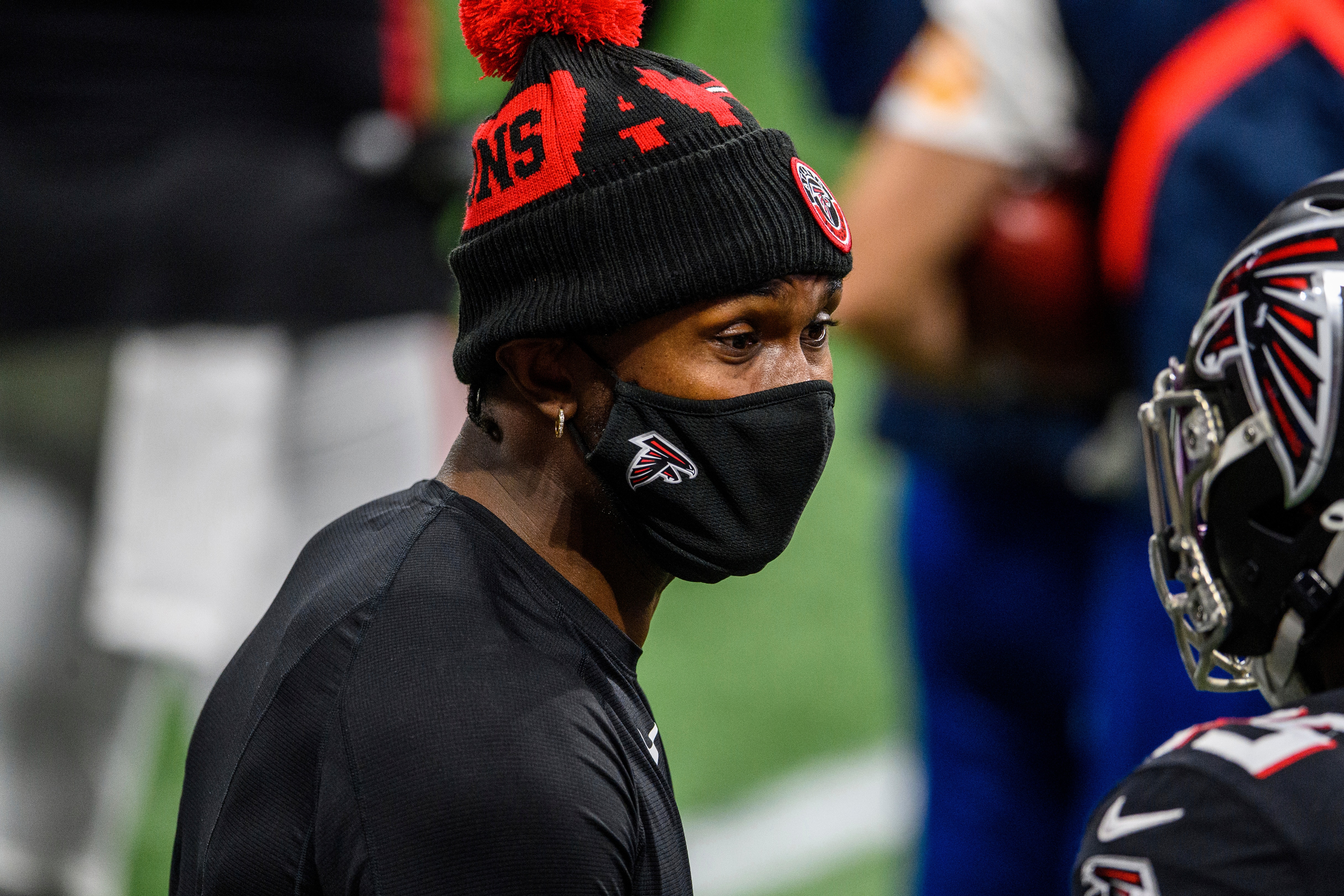 FILE - Atlanta Falcons wide receiver Julio Jones (11) speaks to a teammate during the second half of an NFL football game against the Tampa Bay Buccaneers, in Atlanta, in this Sunday, Dec. 20, 2020, file photo.  The Atlanta Falcons began their offseason training program Tuesday, May 25, 2021, without longtime star receiver Julio Jones, who apparently has no intention of returning to a rebuilding team that is still struggling to get under the salary cap. (AP Photo/Danny Karnik, File)