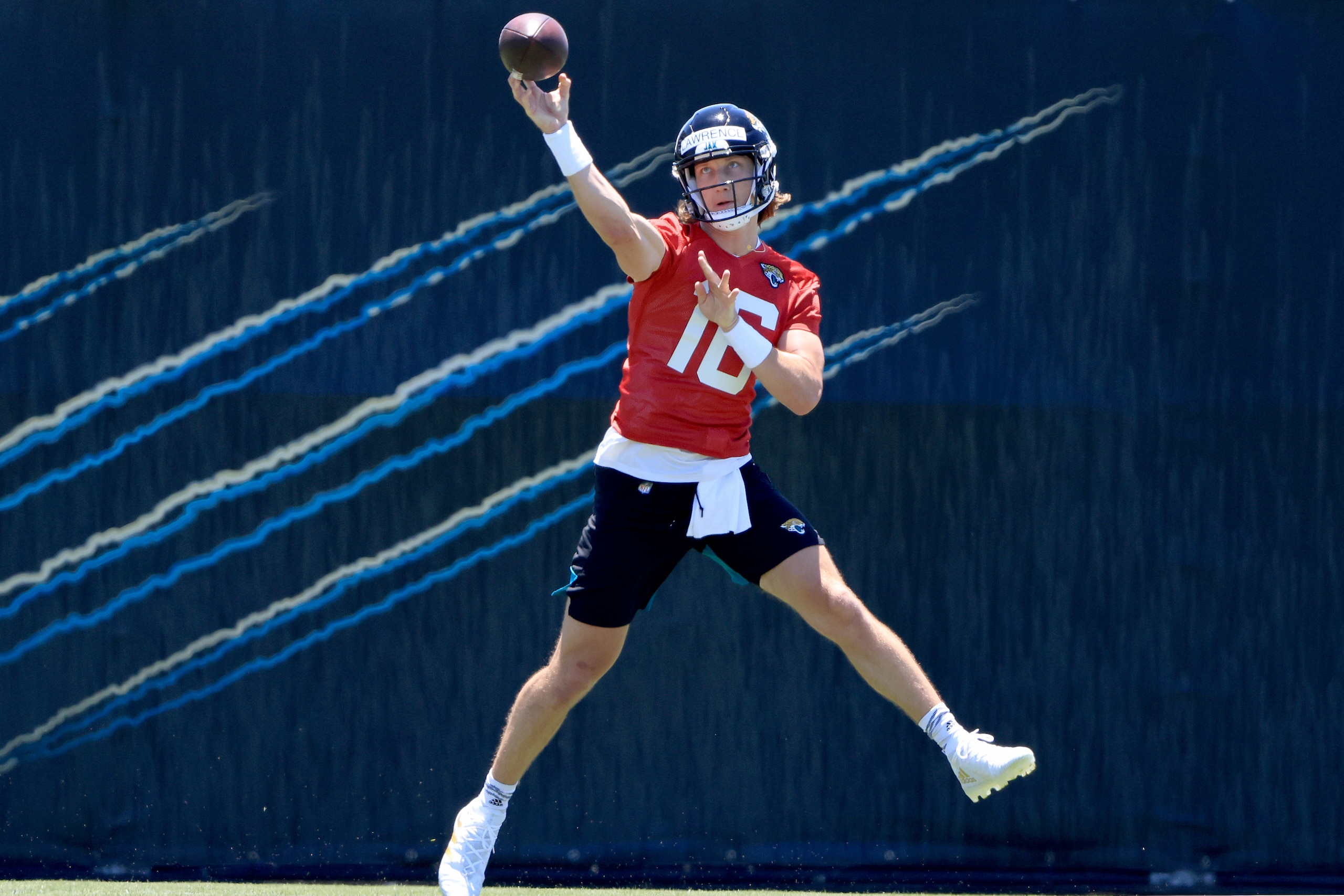 JACKSONVILLE, FLORIDA - MAY 15: Trevor Lawrence #16 of the Jacksonville Jaguars runs drills during Jacksonville Jaguars Training Camp at TIAA Bank Field on May 15, 2021 in Jacksonville, Florida. (Photo by Sam Greenwood/Getty Images)