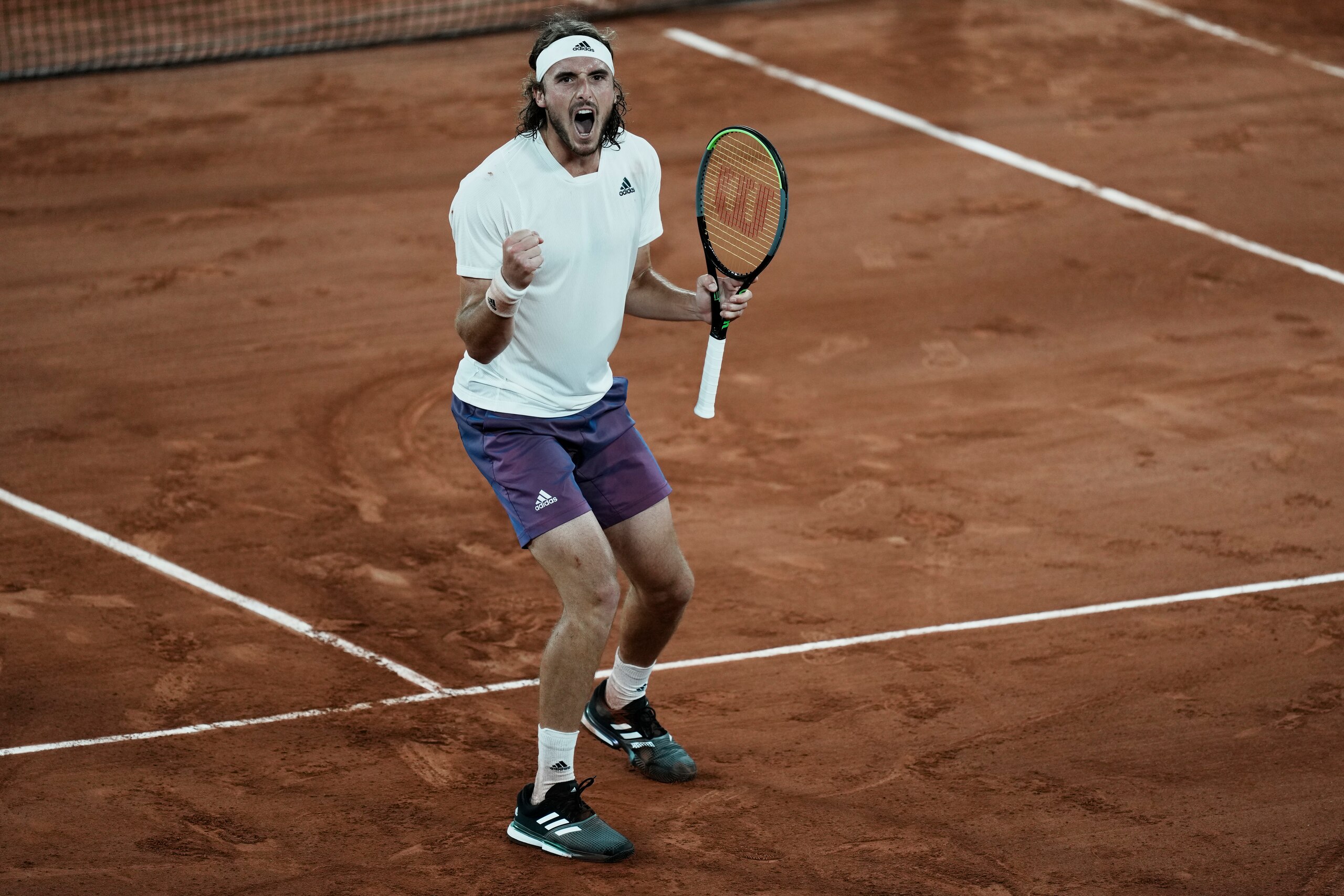 Stefanos Tsitsipas of Greece celebrates after defeating Russia's Daniil Medvedev during their quarterfinal match of the French Open tennis tournament at the Roland Garros stadium Tuesday, June 8, 2021 in Paris. (AP Photo/Thibault Camus)