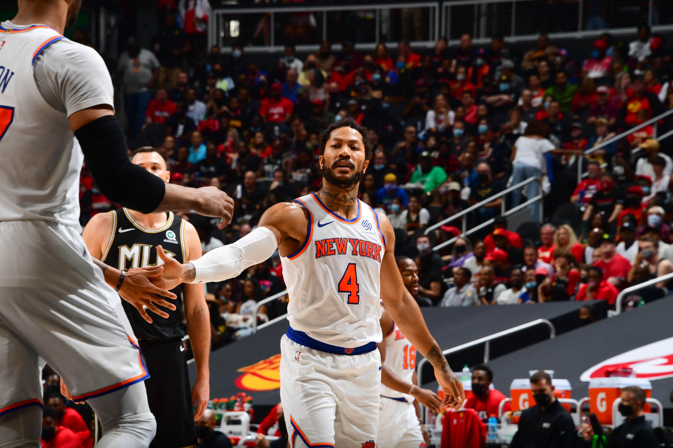 ATLANTA, GA - MAY 30: Derrick Rose #4 of the New York Knicks high fives Taj Gibson #67 of the New York Knicks during Round 1, Game 4 of the 2021 NBA Playoffs on May 30, 2021 at State Farm Arena in Atlanta, Georgia.  NOTE TO USER: User expressly acknowledges and agrees that, by downloading and/or using this Photograph, user is consenting to the terms and conditions of the Getty Images License Agreement. Mandatory Copyright Notice: Copyright 2021 NBAE (Photo by Scott Cunningham/NBAE via Getty Images)