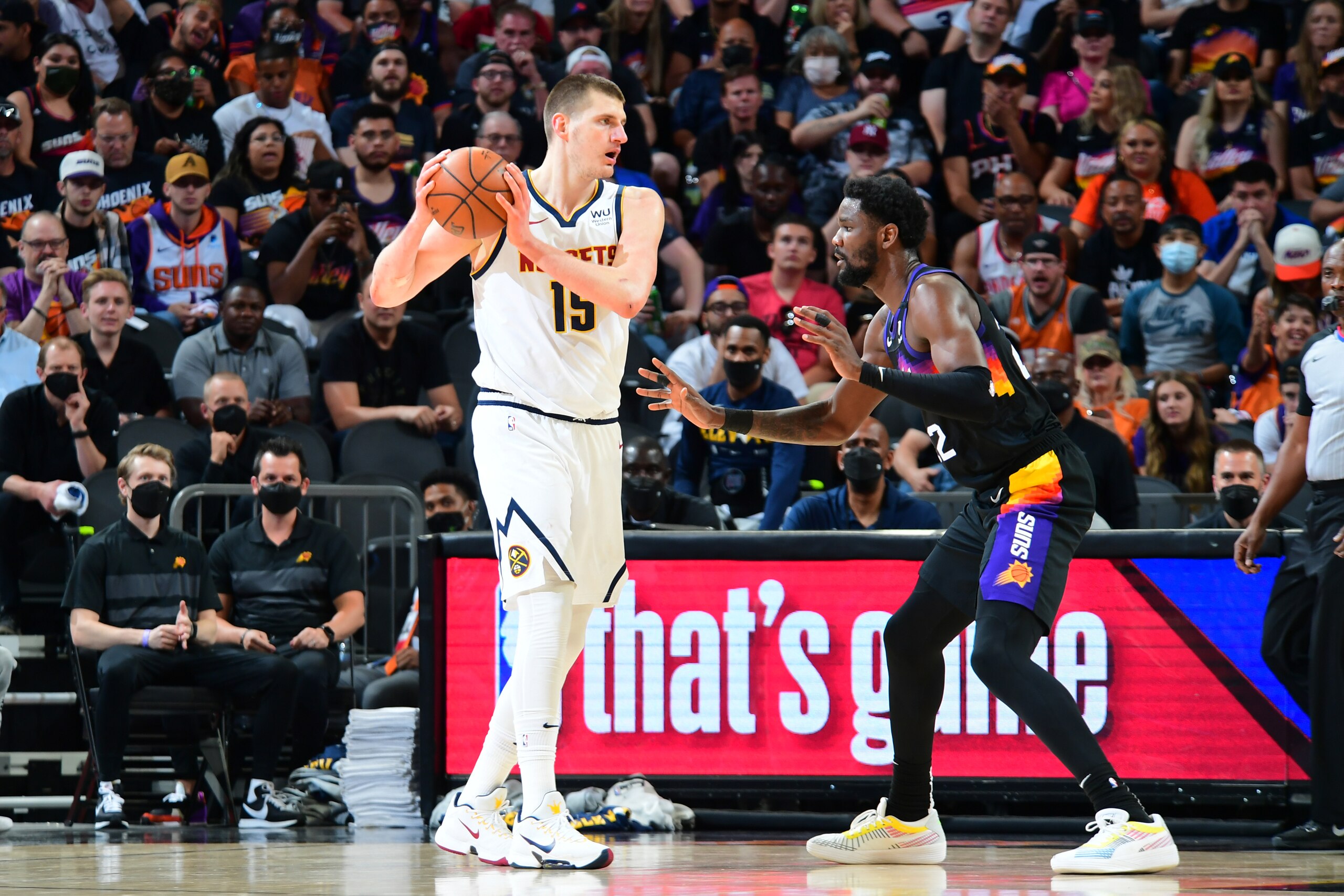 PHOENIX, AZ - JUNE 7: Nikola Jokic #15 of the Denver Nuggets handles the ball during the game against the Phoenix Suns during Round 2, Game 1 of the 2021 NBA Playoffs on June 7, 2021 at Talking Stick Resort Arena in Phoenix, Arizona. NOTE TO USER: User expressly acknowledges and agrees that, by downloading and or using this photograph, user is consenting to the terms and conditions of the Getty Images License Agreement. Mandatory Copyright Notice: Copyright 2021 NBAE (Photo by Michael Gonzales/NBAE via Getty Images)