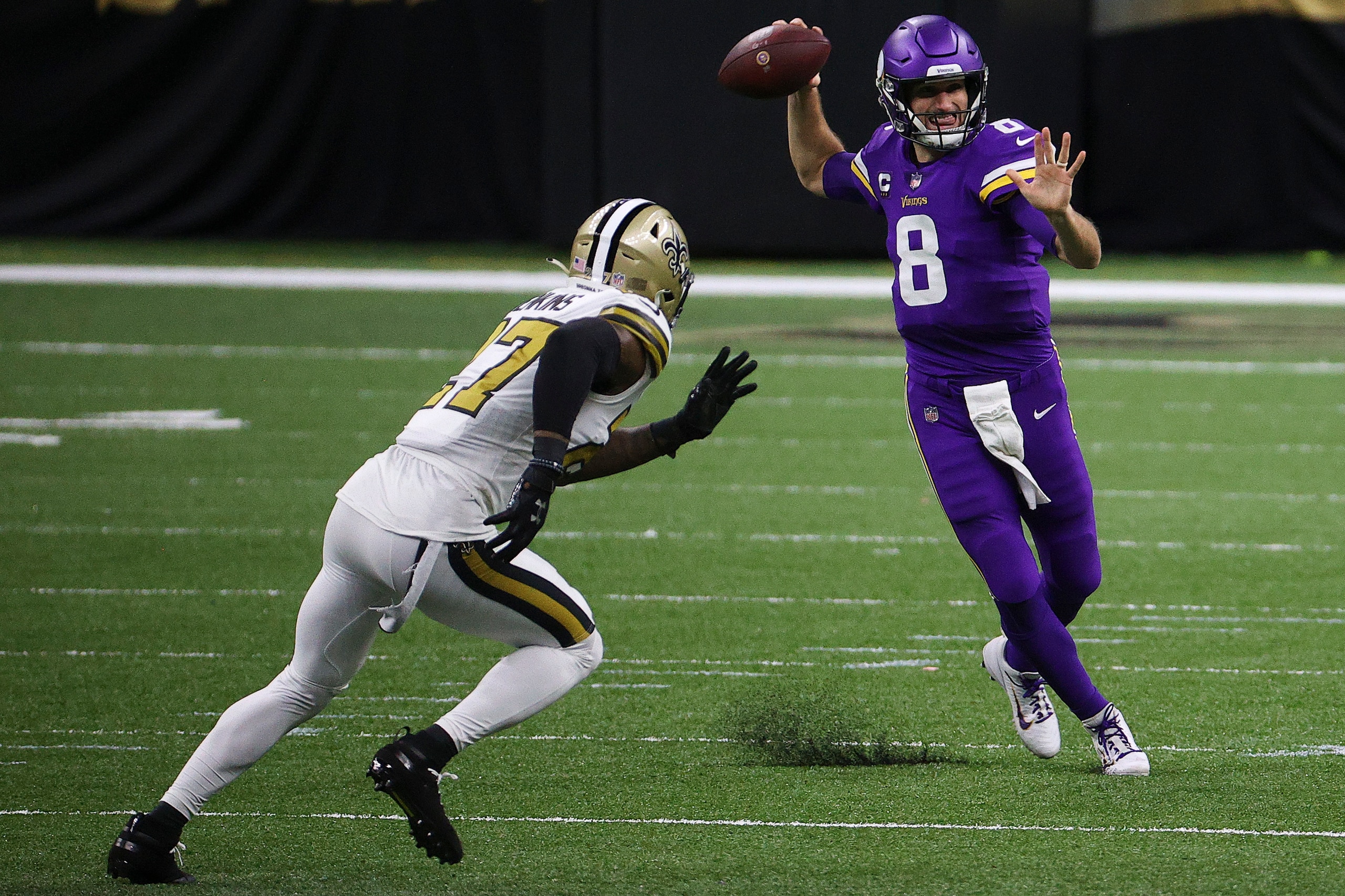 NEW ORLEANS, LOUISIANA - DECEMBER 25: Kirk Cousins #8 of the Minnesota Vikings attempts a pass over Malcolm Jenkins #27 of the New Orleans Saints during the second quarter at Mercedes-Benz Superdome on December 25, 2020 in New Orleans, Louisiana. (Photo by Chris Graythen/Getty Images)