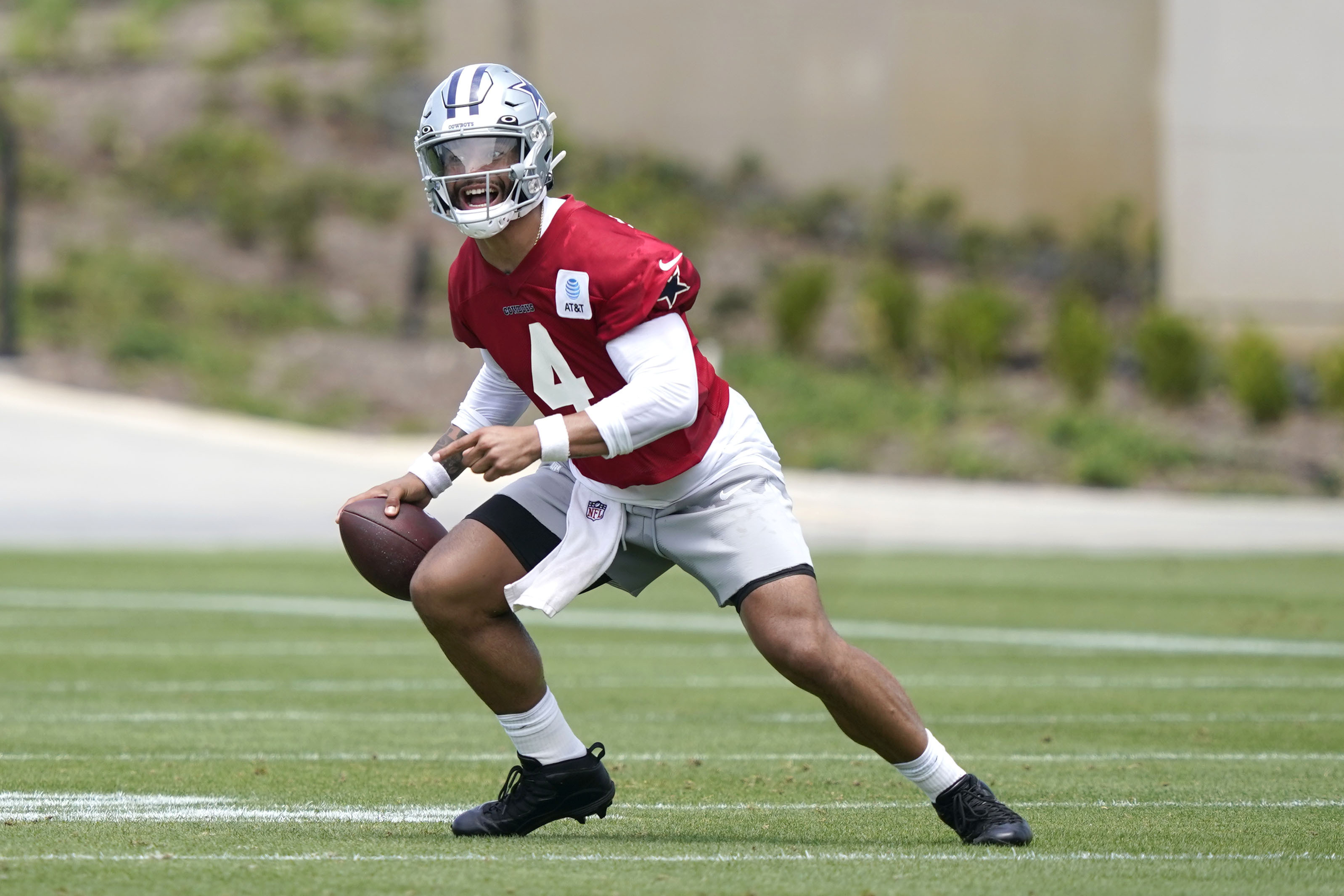 Dallas Cowboys quarterback Dak Prescott looks to pass during an NFL football team practice Tuesday, June 8, 2021, in Frisco, Texas. (AP Photo/LM Otero)