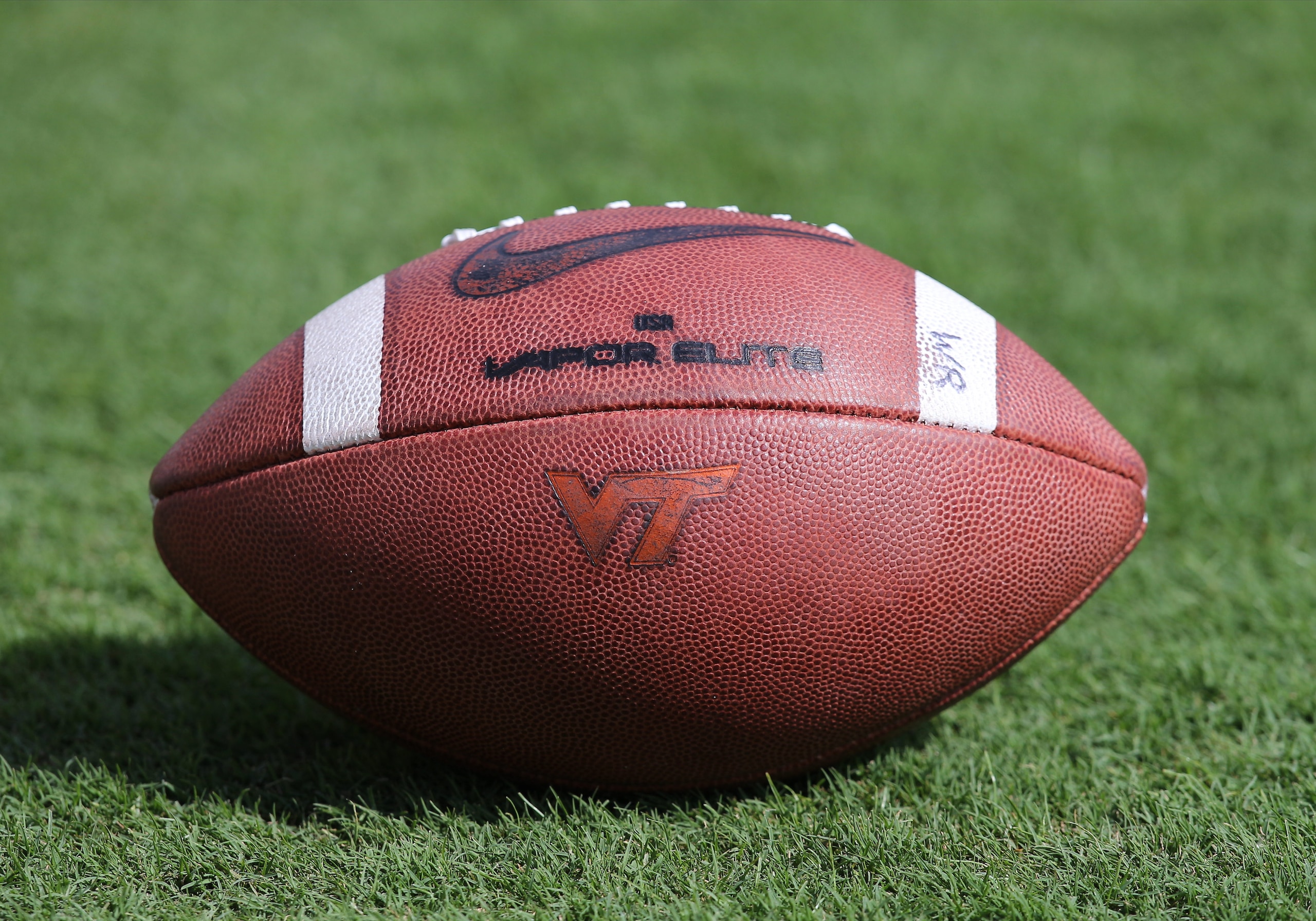 BLACKSBURG, VA SEPTEMBER 07: Virginia Tech football with VT logo resting on field prior to the game between the Virginia Tech Hokies and the Old Dominion Monarchs on September 07, 2019, at Lane Stadium on Worsham Field in Blacksburg, VA. (Photo by Lee Coleman/Icon Sportswire via Getty Images) BLACKSBURG, VA SEPTEMBER 07: Virginia Tech football with VT logo resting on field prior to the game between the Virginia Tech Hokies and the Old Dominion Monarchs on September 07, 2019, at Lane Stadium on Worsham Field in Blacksburg, VA. (Photo by Lee Coleman/Icon Sportswire via Getty Images)