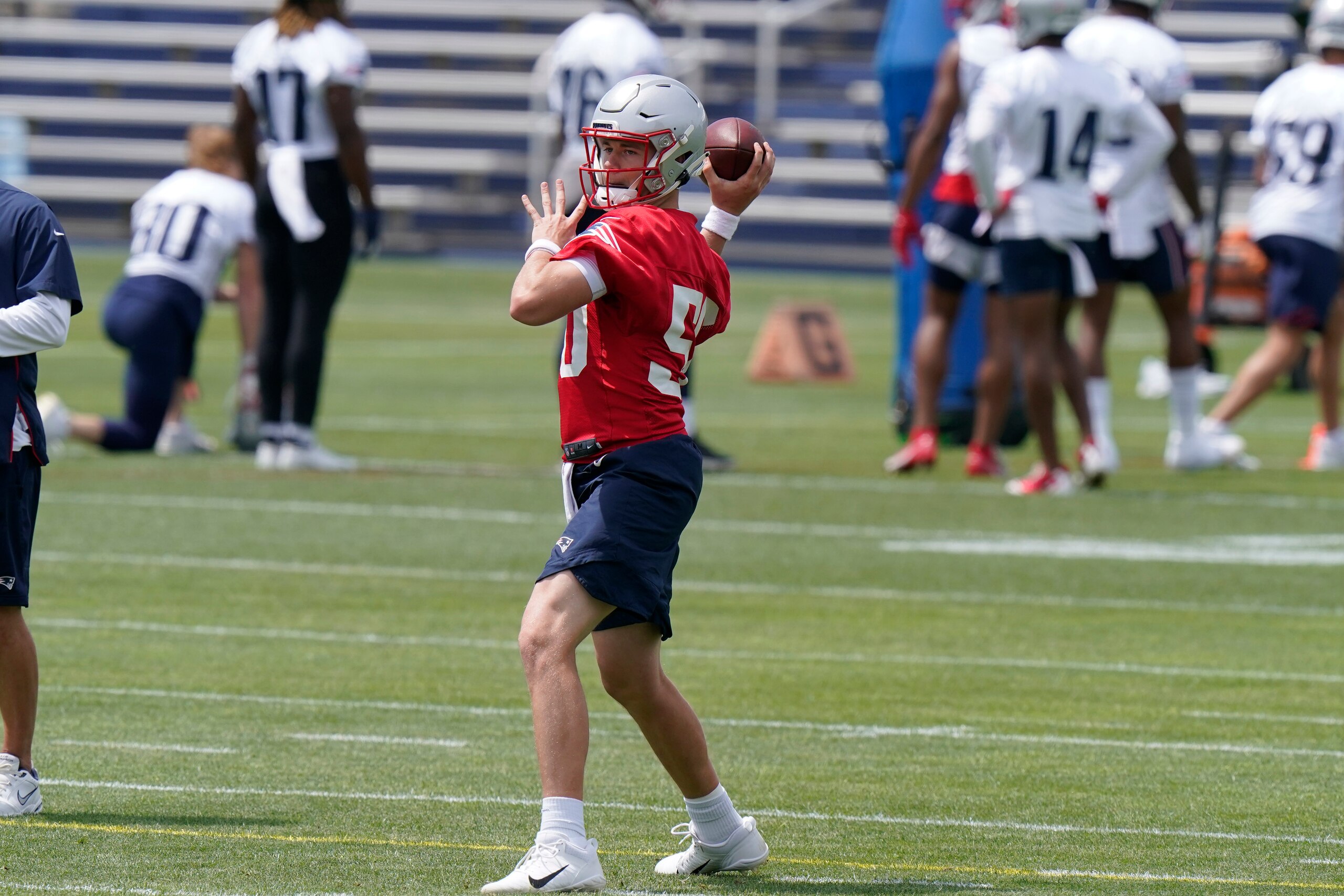 New England Patriots quarterback Mac Jones winds up to pass during an NFL football practice, in Foxborough, Mass., Thursday, June 10, 2021. (AP Photo/Steven Senne)