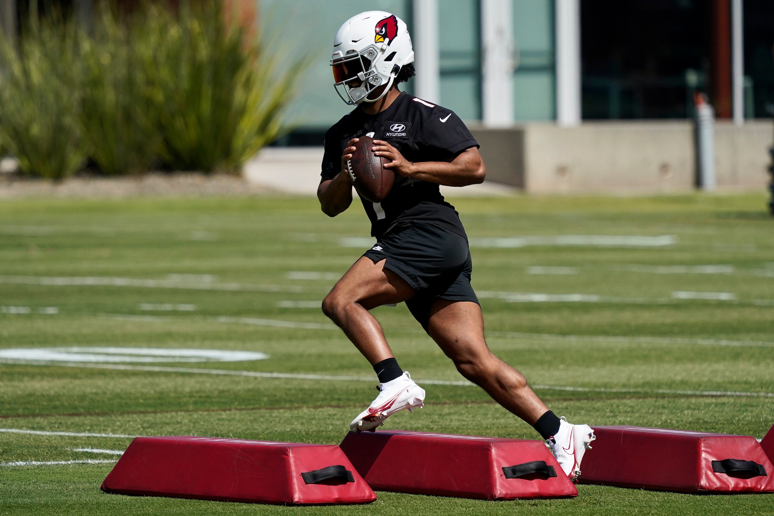 Arizona Cardinals quarterback Kyler Murray runs drills during an NFL football minicamp, Tuesday, June 8, 2021, in Tempe, Ariz. (AP Photo/Matt York)