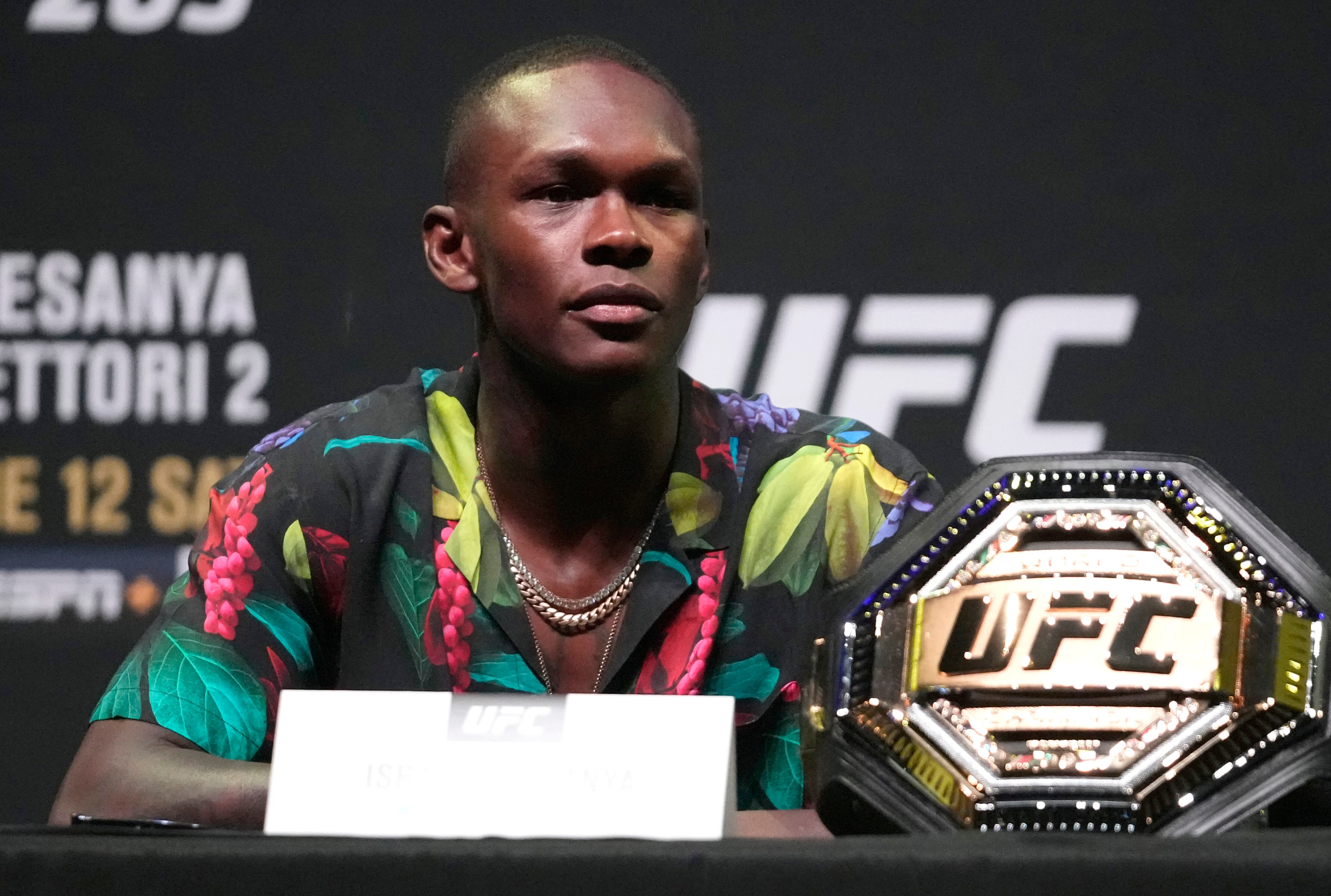 PHOENIX, ARIZONA - JUNE 10: Israel Adesanya of Nigeria interacts with media during the UFC 263 press conference at Arizona Federal Theater on June 10, 2021 in Phoenix, Arizona. (Photo by Jeff Bottari/Zuffa LLC)